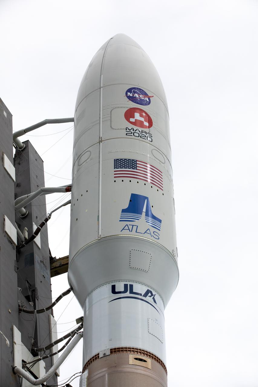 The United Launch Alliance Atlas V 541 rocket, carrying NASA’s Mars Perseverance rover and Ingenuity helicopter, begins rollout from the Vertical Integration Facility to the launch pad at Space Launch Complex 41 at Cape Canaveral Air Force Station on July 28, 2020. First motion was at 10:24 a.m. EDT. Launch of the Mars 2020 mission is scheduled for July 30. The rover is part of NASA’s Mars Exploration Program, a long-term effort of robotic exploration of the Red Planet. The rover will search for habitable conditions in the ancient past and signs of past microbial life on Mars. The Launch Services Program at Kennedy is responsible for launch management.