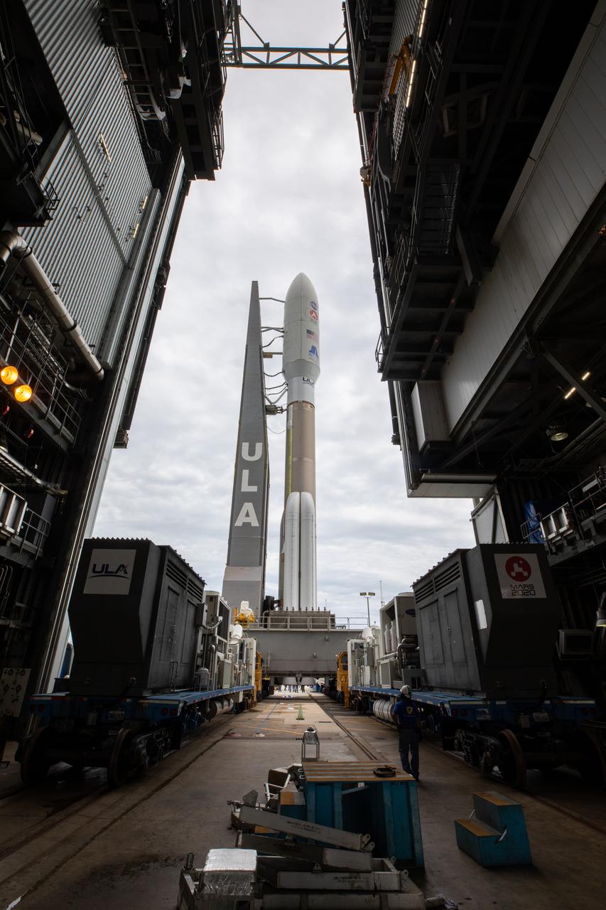 The United Launch Alliance Atlas V 541 rocket, carrying NASA’s Mars Perseverance rover and Ingenuity helicopter, rolls out from the Vertical Integration Facility and moves along to the launch pad at Space Launch Complex 41 at Cape Canaveral Air Force Station on July 28, 2020. First motion was at 10:24 a.m. EDT. Launch of the Mars 2020 mission is scheduled for July 30. The rover is part of NASA’s Mars Exploration Program, a long-term effort of robotic exploration of the Red Planet. The rover will search for habitable conditions in the ancient past and signs of past microbial life on Mars. The Launch Services Program at Kennedy is responsible for launch management.