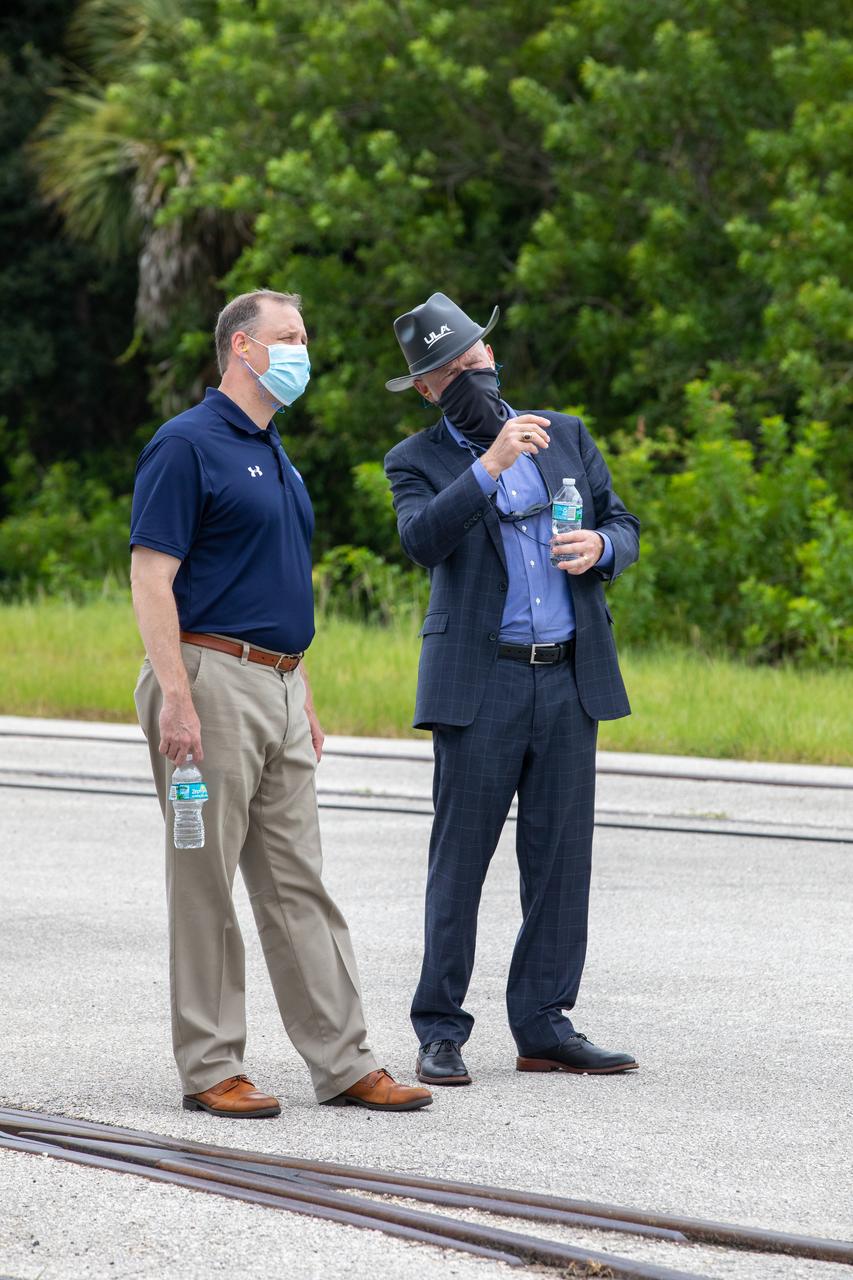 NASA Administrator Jim Bridenstine, at left, and Tory Bruno, CEO of United Launch Alliance (ULA), watch the rollout of the ULA Atlas V 541 rocket, carrying NASA’s Mars Perseverance rover and Ingenuity helicopter, as it rolls along to the launch pad at Space Launch Complex 41 at Cape Canaveral Air Force Station on July 28, 2020. First motion was at 10:24 a.m. EDT. Launch of the Mars 2020 mission is scheduled for July 30. The rover is part of NASA’s Mars Exploration Program, a long-term effort of robotic exploration of the Red Planet. The rover will search for habitable conditions in the ancient past and signs of past microbial life on Mars. The Launch Services Program at Kennedy is responsible for launch management.