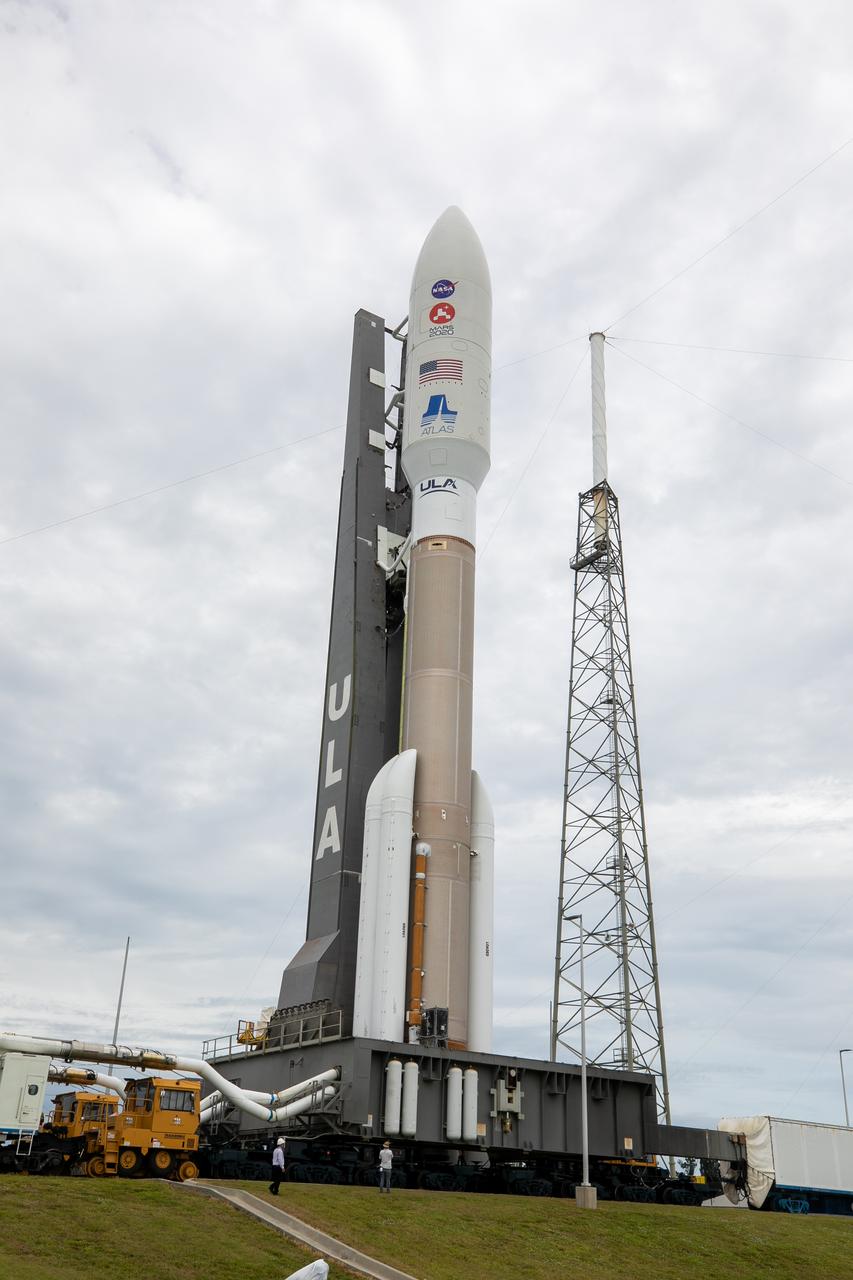 The United Launch Alliance Atlas V 541 rocket, carrying NASA’s Mars Perseverance rover and Ingenuity helicopter, rolls along to the launch pad at Space Launch Complex 41 at Cape Canaveral Air Force Station on July 28, 2020. First motion was at 10:24 a.m. EDT. Launch of the Mars 2020 mission is scheduled for July 30. The rover is part of NASA’s Mars Exploration Program, a long-term effort of robotic exploration of the Red Planet. The rover will search for habitable conditions in the ancient past and signs of past microbial life on Mars. The Launch Services Program at Kennedy is responsible for launch management.