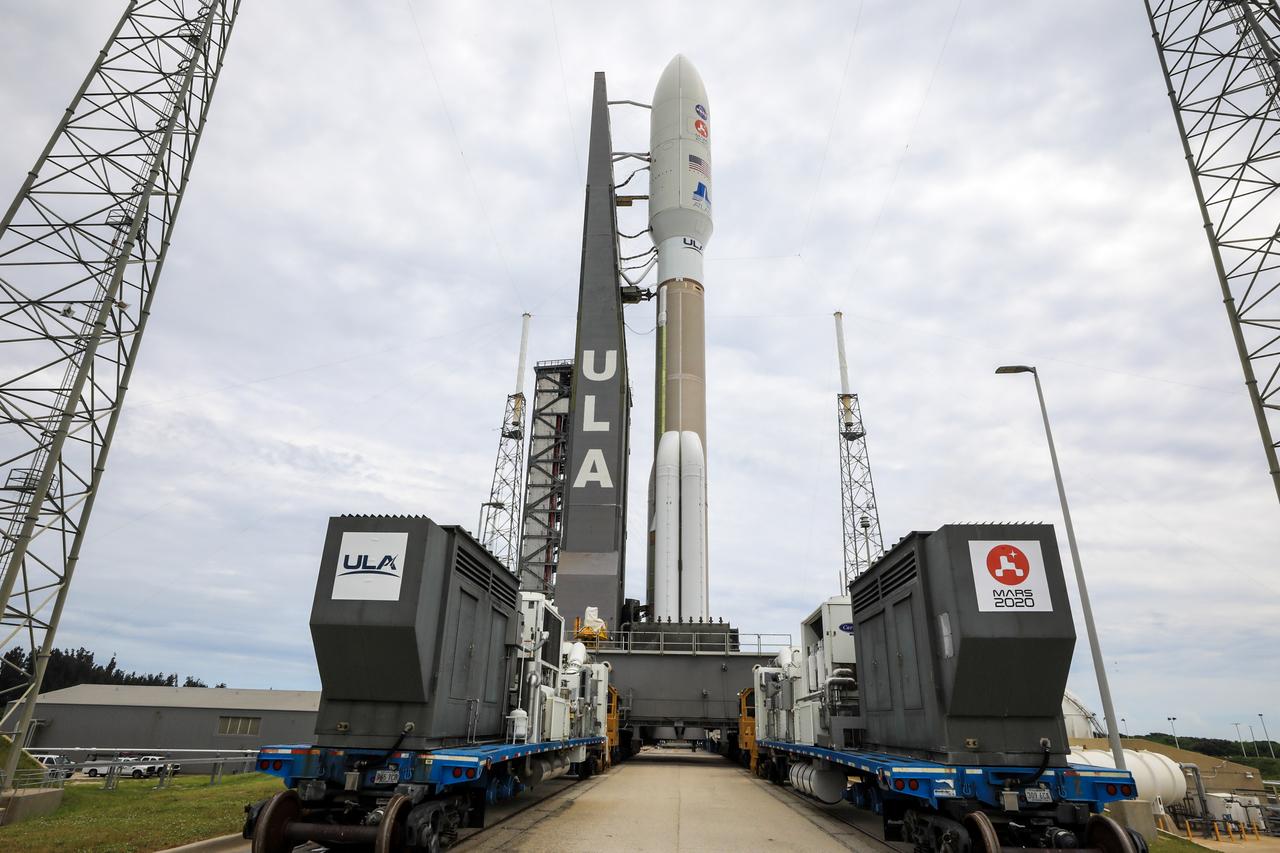 The United Launch Alliance Atlas V 541 rocket, carrying NASA’s Mars Perseverance rover and Ingenuity helicopter, rolls along to the launch pad at Space Launch Complex 41 at Cape Canaveral Air Force Station on July 28, 2020. First motion was at 10:24 a.m. EDT. Launch of the Mars 2020 mission is scheduled for July 30. The rover is part of NASA’s Mars Exploration Program, a long-term effort of robotic exploration of the Red Planet. The rover will search for habitable conditions in the ancient past and signs of past microbial life on Mars. The Launch Services Program at Kennedy is responsible for launch management. 