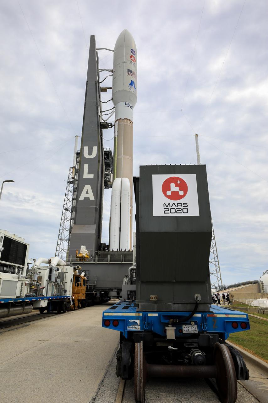 The United Launch Alliance Atlas V 541 rocket, carrying NASA’s Mars Perseverance rover and Ingenuity helicopter, rolls along to the launch pad at Space Launch Complex 41 at Cape Canaveral Air Force Station on July 28, 2020. First motion was at 10:24 a.m. EDT. Launch of the Mars 2020 mission is scheduled for July 30. The rover is part of NASA’s Mars Exploration Program, a long-term effort of robotic exploration of the Red Planet. The rover will search for habitable conditions in the ancient past and signs of past microbial life on Mars. The Launch Services Program at Kennedy is responsible for launch management. 