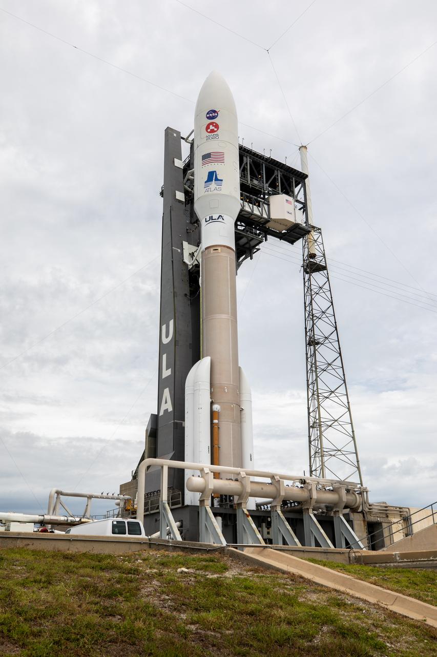 The United Launch Alliance Atlas V 541 rocket, carrying NASA’s Mars Perseverance rover and Ingenuity helicopter, arrives at the launch pad at Space Launch Complex 41 at Cape Canaveral Air Force Station on July 28, 2020. First motion from the Vertical Integration Facility was at 10:24 a.m. EDT. Launch of the Mars 2020 mission is scheduled for July 30. The rover is part of NASA’s Mars Exploration Program, a long-term effort of robotic exploration of the Red Planet. The rover will search for habitable conditions in the ancient past and signs of past microbial life on Mars. The Launch Services Program at Kennedy is responsible for launch management. 