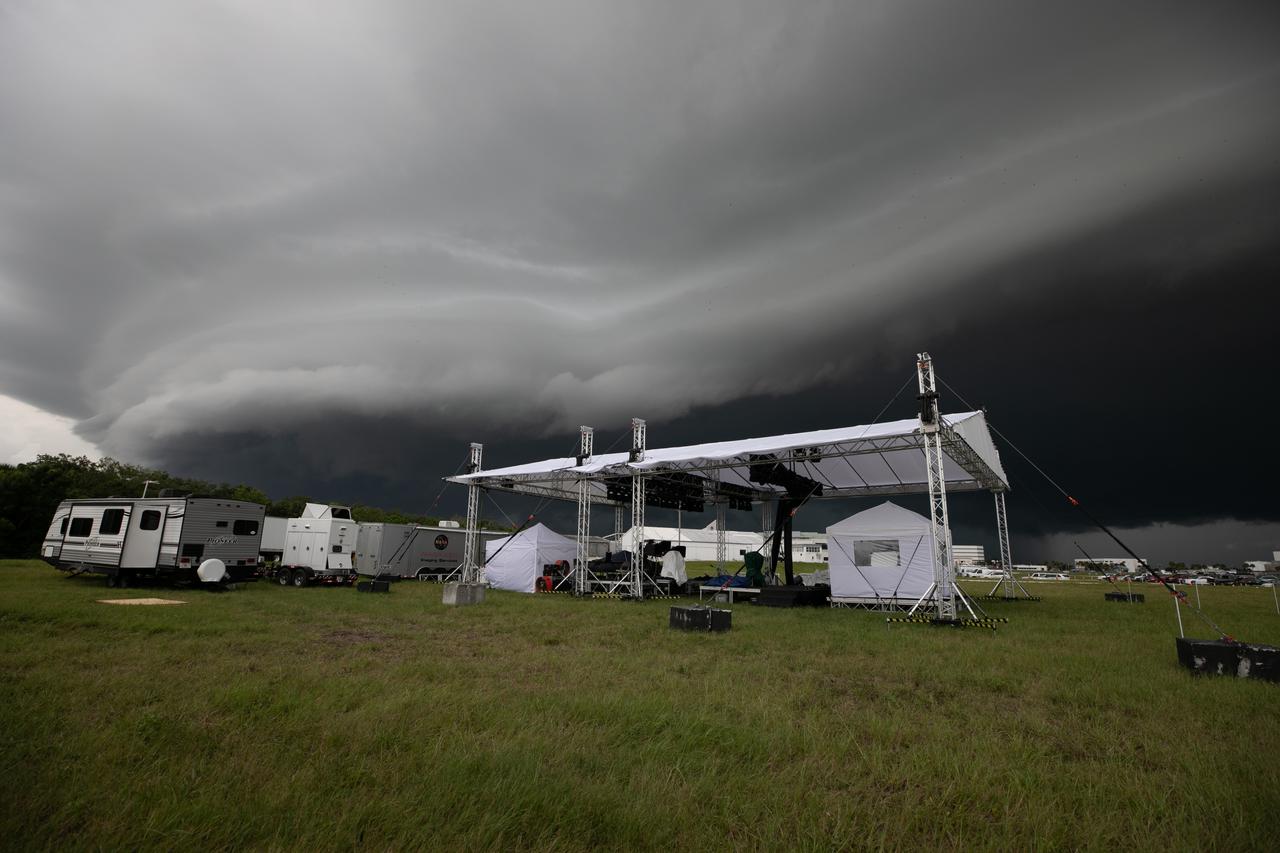 On July 28, 2020, storm clouds roll in over the Press Site lawn, where an exterior host set is being constructed in preparation for NASA’s Mars 2020 launch broadcast at the agency’s Kennedy Space Center in Florida. The United Launch Alliance Atlas V 541 rocket, with the Mars Perseverance rover aboard, lifted off from nearby Cape Canaveral Air Force Station’s Space Launch Complex 41 on July 30 at 7:50 a.m. EDT. Once it arrives at the Red Planet, the rover will search for signs of ancient microbial life on Mars.