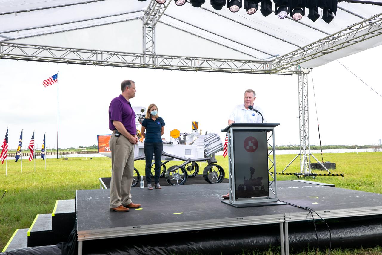 NASA Deputy Administrator Jim Morhard speaks at the podium during a briefing at the agency’s Kennedy Space Center in Florida on July 29, 2020, in advance of the launch of the Mars 2020 Perseverance rover and Ingenuity helicopter scheduled for July 30. Joining him are, from left, NASA Administrator Jim Bridenstine, and NASA astronaut Zena Cardman. Mars 2020 will lift off aboard a United Launch Alliance Atlas V 541 rocket from Space Launch Complex 41 at Cape Canaveral Air Force Station. The two-hour launch window opens at 7:50 a.m. EDT. NASA’s Launch Services Program, based at Kennedy, is managing the launch.
