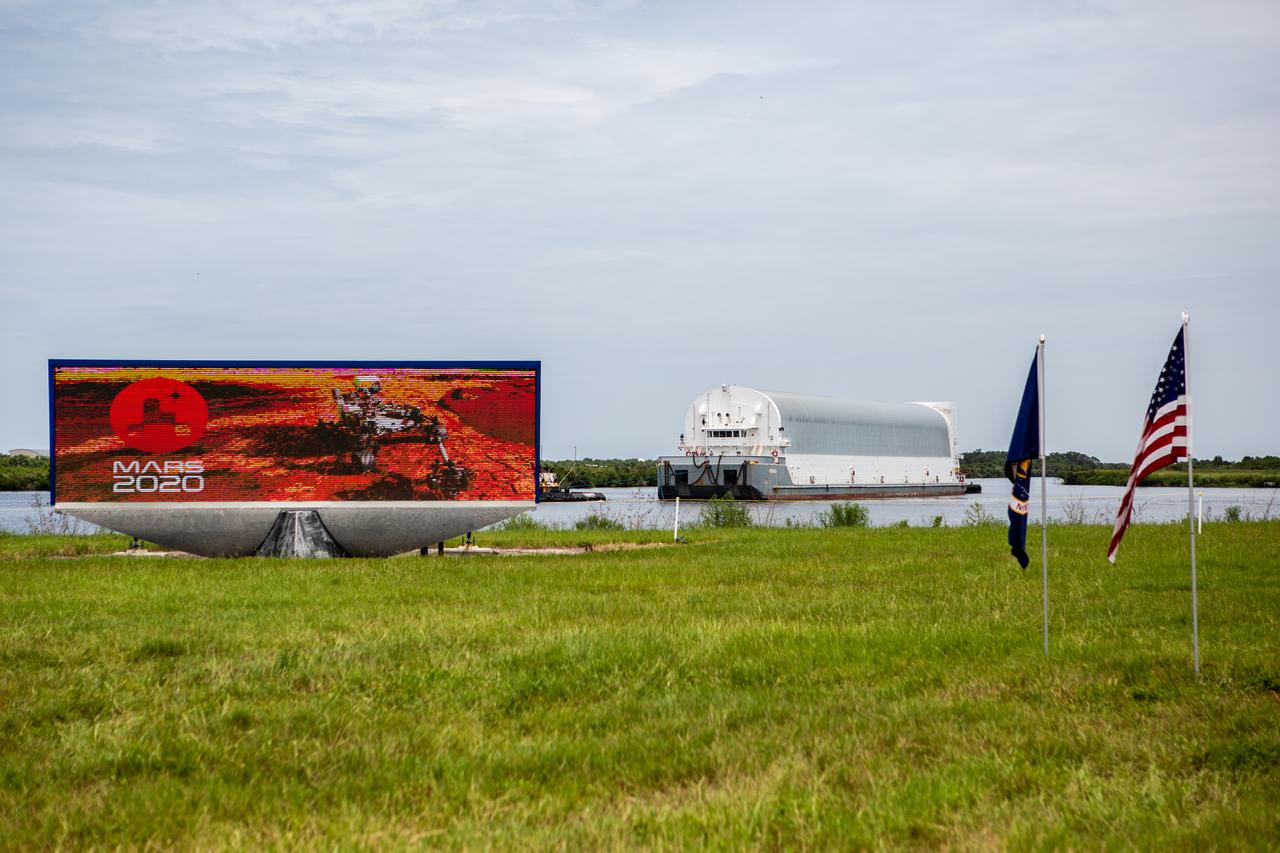 NASA’s Pegasus barge, carrying the launch vehicle stage adapter (LVSA) for the agency’s Space Launch System (SLS) rocket, approaches the Kennedy Space Center Launch Complex 39 turn basin wharf on July 29, 2020. Traveling to Florida from NASA’s Marshall Space Flight Center in Huntsville, Alabama, the LVSA will connect the SLS core stage to the rocket’s upper stage for the Artemis I launch. Once the LVSA is offloaded, it will be moved to High Bay 4 in the Vehicle Assembly Building for processing ahead of launch. The first launch under the agency’s Artemis program, Artemis I will test SLS and the Orion spacecraft as an integrated system prior to crewed flights to the Moon.