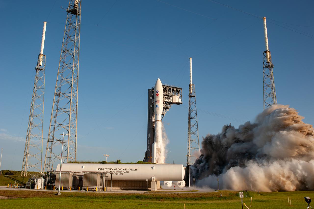 With blue sky as a backdrop, a United Launch Alliance Atlas V 541 rocket lifts off from Space Launch Complex 41 at Cape Canaveral Air Force Station in Florida on July 30, 2020, at 7:50 a.m. EDT, carrying NASA’s Mars Perseverance rover and Ingenuity helicopter. The rover is part of NASA’s Mars Exploration Program, a long-term effort of robotic exploration of the Red Planet. The rover’s seven instruments will search for habitable conditions in the ancient past and signs of past microbial life on Mars. The Launch Services Program at Kennedy is responsible for launch management. 