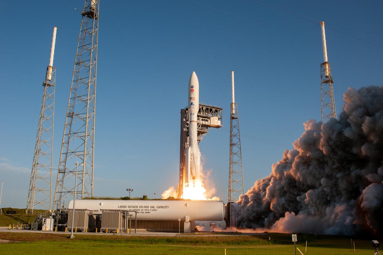 With blue sky as a backdrop, a United Launch Alliance Atlas V 541 rocket lifts off from Space Launch Complex 41 at Cape Canaveral Air Force Station in Florida on July 30, 2020, at 7:50 a.m. EDT, carrying NASA’s Mars Perseverance rover and Ingenuity helicopter. The rover is part of NASA’s Mars Exploration Program, a long-term effort of robotic exploration of the Red Planet. The rover’s seven instruments will search for habitable conditions in the ancient past and signs of past microbial life on Mars. The Launch Services Program at Kennedy is responsible for launch management. 