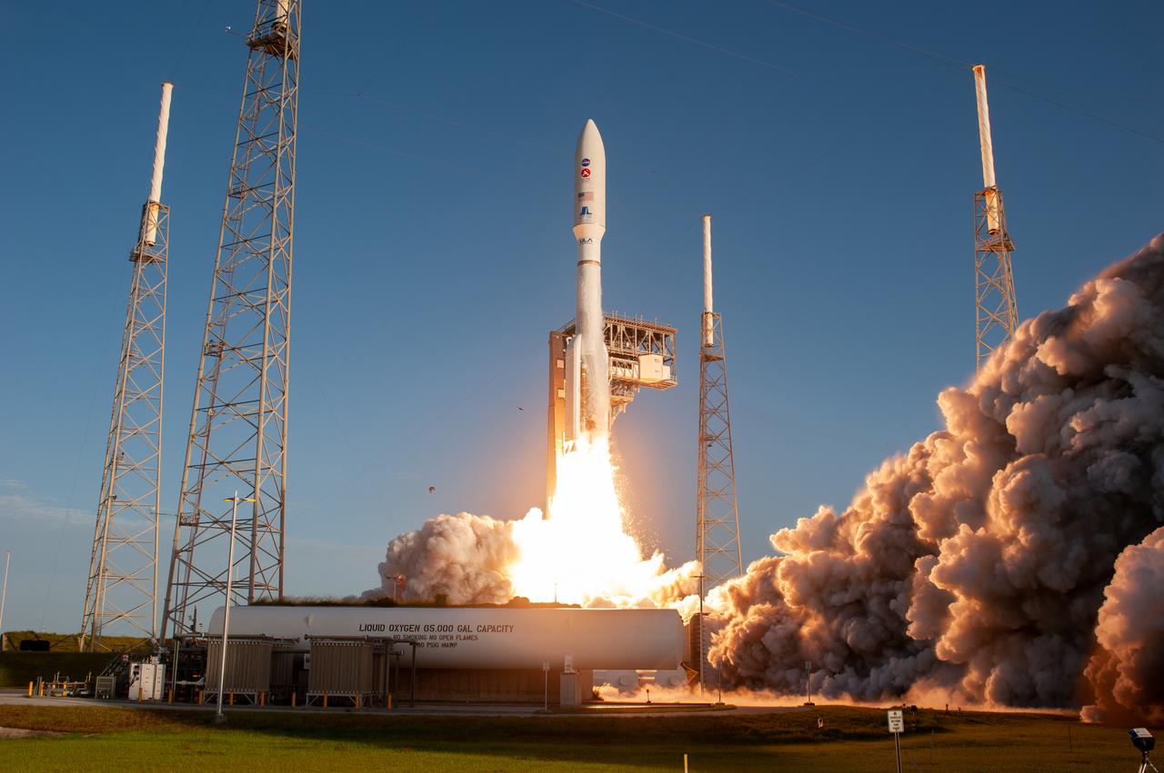 With blue sky as a backdrop, a United Launch Alliance Atlas V 541 rocket lifts off from Space Launch Complex 41 at Cape Canaveral Air Force Station in Florida on July 30, 2020, at 7:50 a.m. EDT, carrying NASA’s Mars Perseverance rover and Ingenuity helicopter. The rover is part of NASA’s Mars Exploration Program, a long-term effort of robotic exploration of the Red Planet. The rover’s seven instruments will search for habitable conditions in the ancient past and signs of past microbial life on Mars. The Launch Services Program at Kennedy is responsible for launch management.
