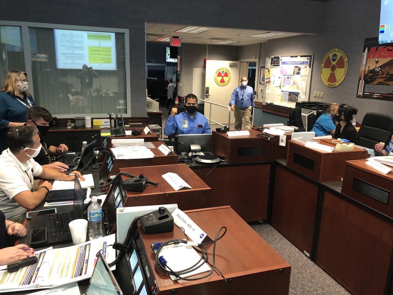 Joint Information Center (JIC), Emergency Operations Center (EOC) and Radiation Control Center (RADCC) members prepare for the launch of NASA’s Mars 2020 Perseverance rover and Ingenuity helicopter on July 30, 2020, at the agency’s Kennedy Space Center in Florida. JIC members include representatives on the local, regional and national level. Mars 2020 launched on a United Launch Alliance Atlas V 541 rocket from Space Launch Complex 41 at nearby Cape Canaveral Air Force Station. Liftoff was at 7:50 a.m. EDT. The rover is part of NASA’s Mars Exploration Program, a long-term effort of robotic exploration of the Red Planet. The rover will search for habitable conditions in the ancient past and signs of past microbial life on Mars. The Launch Services Program at Kennedy is responsible for launch management.
