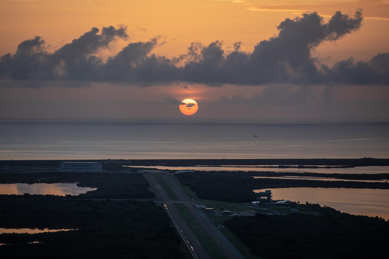 The Sun rises on the Space Coast as NASA’s Kennedy Space Center in Florida prepares for the launch of a United Launch Alliance Atlas V rocket, carrying the agency’s Mars Perseverance rover and Ingenuity helicopter, on July 30, 2020. Liftoff is targeted for 7:50 a.m. EDT. The Perseverance rover is part of NASA’s Mars Exploration Program, a long-term effort of robotic exploration of the Red Planet. The rover’s seven instruments will search for habitable conditions in the ancient past and signs of past microbial life on Mars. The Launch Services Program at Kennedy is responsible for launch management.