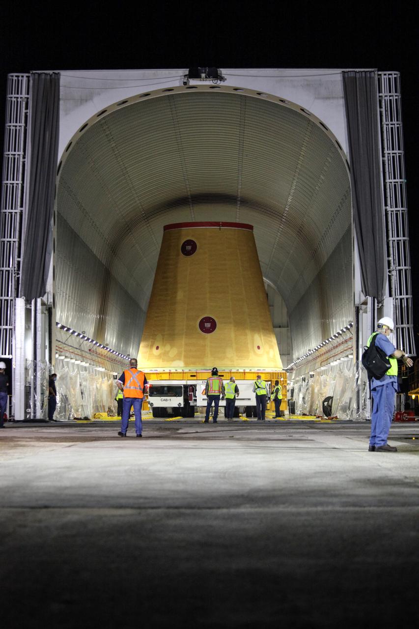 Technicians with NASA’s Exploration Ground Systems prepare to offload the launch vehicle stage adapter (LVSA) for the agency’s Space Launch System (SLS) rocket and move it to the Vehicle Assembly Building (VAB) at NASA’s Kennedy Space Center in Florida on July 30, 2020, for processing. Carried by NASA’s Pegasus barge, the LVSA arrived at Kennedy’s Launch Complex 39 turn basin wharf after departing from the agency’s Marshall Space Flight Center in Huntsville, Alabama. The LVSA will connect the SLS core stage to the rocket’s upper stage and will remain in the VAB until it’s time for stacking on the mobile launcher ahead of the Artemis I launch. The first in a series of increasingly complex missions, Artemis I will test SLS and the Orion spacecraft as an integrated system prior to crewed flights to the Moon.