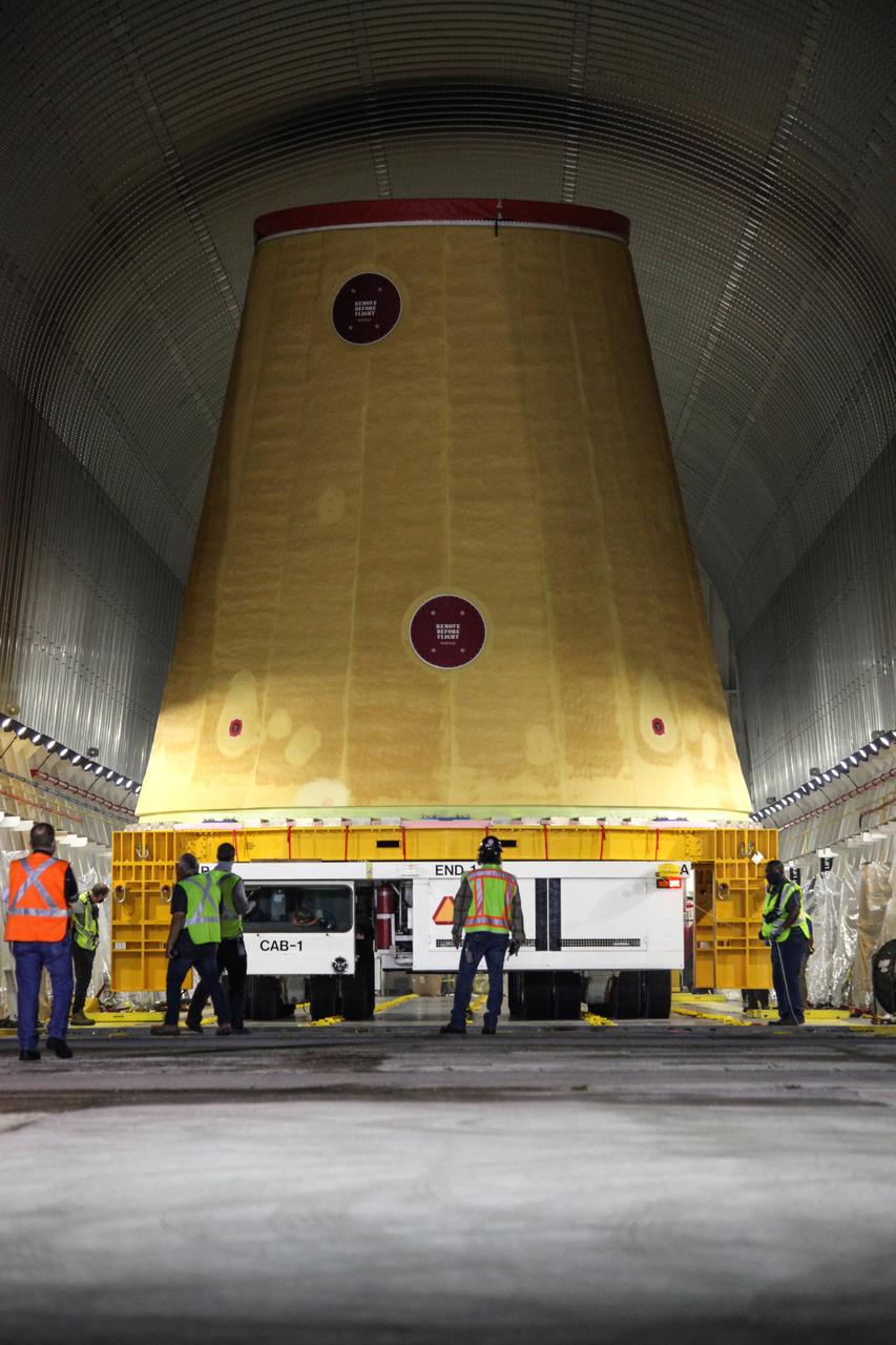Technicians with NASA’s Exploration Ground Systems prepare to offload the launch vehicle stage adapter (LVSA) for the agency’s Space Launch System (SLS) rocket and move it to the Vehicle Assembly Building (VAB) at NASA’s Kennedy Space Center in Florida on July 30, 2020, for processing. Carried by NASA’s Pegasus barge, the LVSA arrived at Kennedy’s Launch Complex 39 turn basin wharf after departing from the agency’s Marshall Space Flight Center in Huntsville, Alabama. The LVSA will connect the SLS core stage to the rocket’s upper stage and will remain in the VAB until it’s time for stacking on the mobile launcher ahead of the Artemis I launch. The first in a series of increasingly complex missions, Artemis I will test SLS and the Orion spacecraft as an integrated system prior to crewed flights to the Moon.