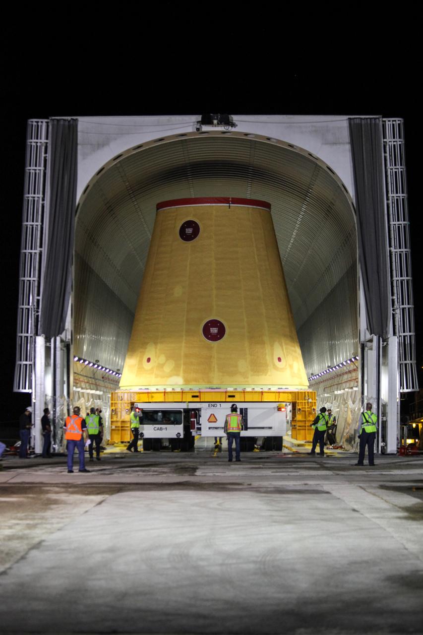 Technicians with NASA’s Exploration Ground Systems prepare to offload the launch vehicle stage adapter (LVSA) for the agency’s Space Launch System (SLS) rocket and move it to the Vehicle Assembly Building (VAB) at NASA’s Kennedy Space Center in Florida on July 30, 2020, for processing. Carried by NASA’s Pegasus barge, the LVSA arrived at Kennedy’s Launch Complex 39 turn basin wharf after departing from the agency’s Marshall Space Flight Center in Huntsville, Alabama. The LVSA will connect the SLS core stage to the rocket’s upper stage and will remain in the VAB until it’s time for stacking on the mobile launcher ahead of the Artemis I launch. The first in a series of increasingly complex missions, Artemis I will test SLS and the Orion spacecraft as an integrated system prior to crewed flights to the Moon.