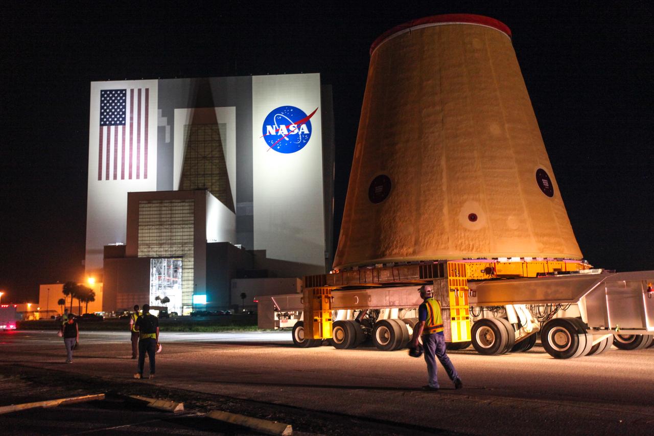 Technicians with NASA’s Exploration Ground Systems move the launch vehicle stage adapter (LVSA) for the agency’s Space Launch System (SLS) rocket to the Vehicle Assembly Building (VAB) on July 30, 2020, for processing. Carried by NASA’s Pegasus barge, the LVSA arrived at Kennedy Space Center’s Launch Complex 39 turn basin wharf after departing from the agency’s Marshall Space Flight Center in Huntsville, Alabama. The LVSA will connect the SLS core stage to the rocket’s upper stage and will remain in the VAB until it’s time for stacking on the mobile launcher ahead of the Artemis I launch. The first in a series of increasingly complex missions, Artemis I will test SLS and the Orion spacecraft as an integrated system prior to crewed flights to the Moon.