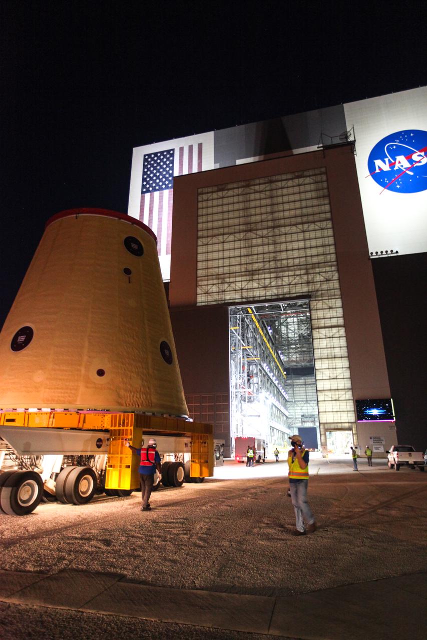 Technicians with NASA’s Exploration Ground Systems move the launch vehicle stage adapter (LVSA) for the agency’s Space Launch System (SLS) rocket into the Vehicle Assembly Building (VAB) at NASA’s Kennedy Space Center in Florida on July 30, 2020, for processing. Carried by NASA’s Pegasus barge, the LVSA arrived at Kennedy’s Launch Complex 39 turn basin wharf after departing from the agency’s Marshall Space Flight Center in Huntsville, Alabama. The LVSA will connect the SLS core stage to the rocket’s upper stage and will remain in the VAB until it’s time for stacking on the mobile launcher ahead of the Artemis I launch. The first in a series of increasingly complex missions, Artemis I will test SLS and the Orion spacecraft as an integrated system prior to crewed flights to the Moon.