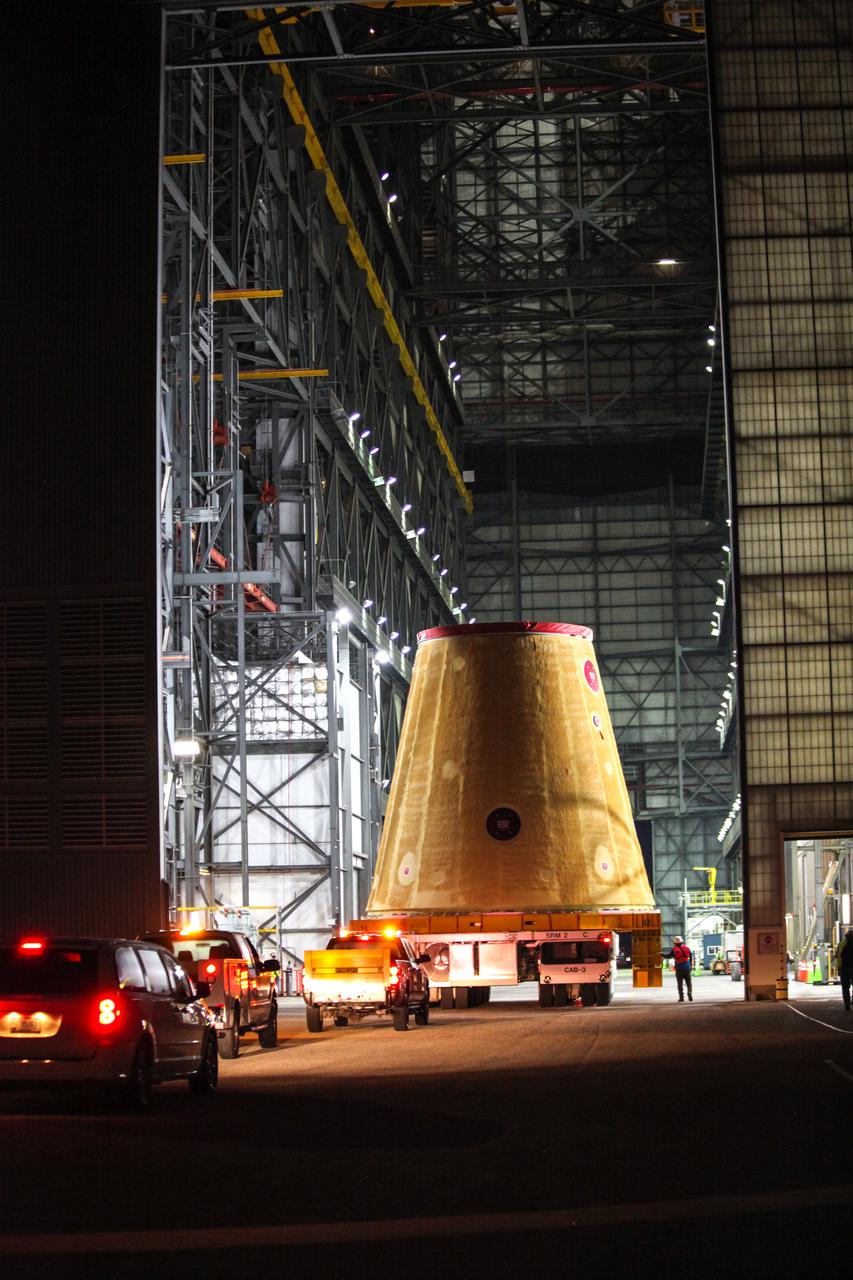 Technicians with NASA’s Exploration Ground Systems move the launch vehicle stage adapter (LVSA) for the agency’s Space Launch System (SLS) rocket into the Vehicle Assembly Building (VAB) at NASA’s Kennedy Space Center in Florida on July 30, 2020, for processing. Carried by NASA’s Pegasus barge, the LVSA arrived at Kennedy’s Launch Complex 39 turn basin wharf after departing from the agency’s Marshall Space Flight Center in Huntsville, Alabama. The LVSA will connect the SLS core stage to the rocket’s upper stage and will remain in the VAB until it’s time for stacking on the mobile launcher ahead of the Artemis I launch. The first in a series of increasingly complex missions, Artemis I will test SLS and the Orion spacecraft as an integrated system prior to crewed flights to the Moon.