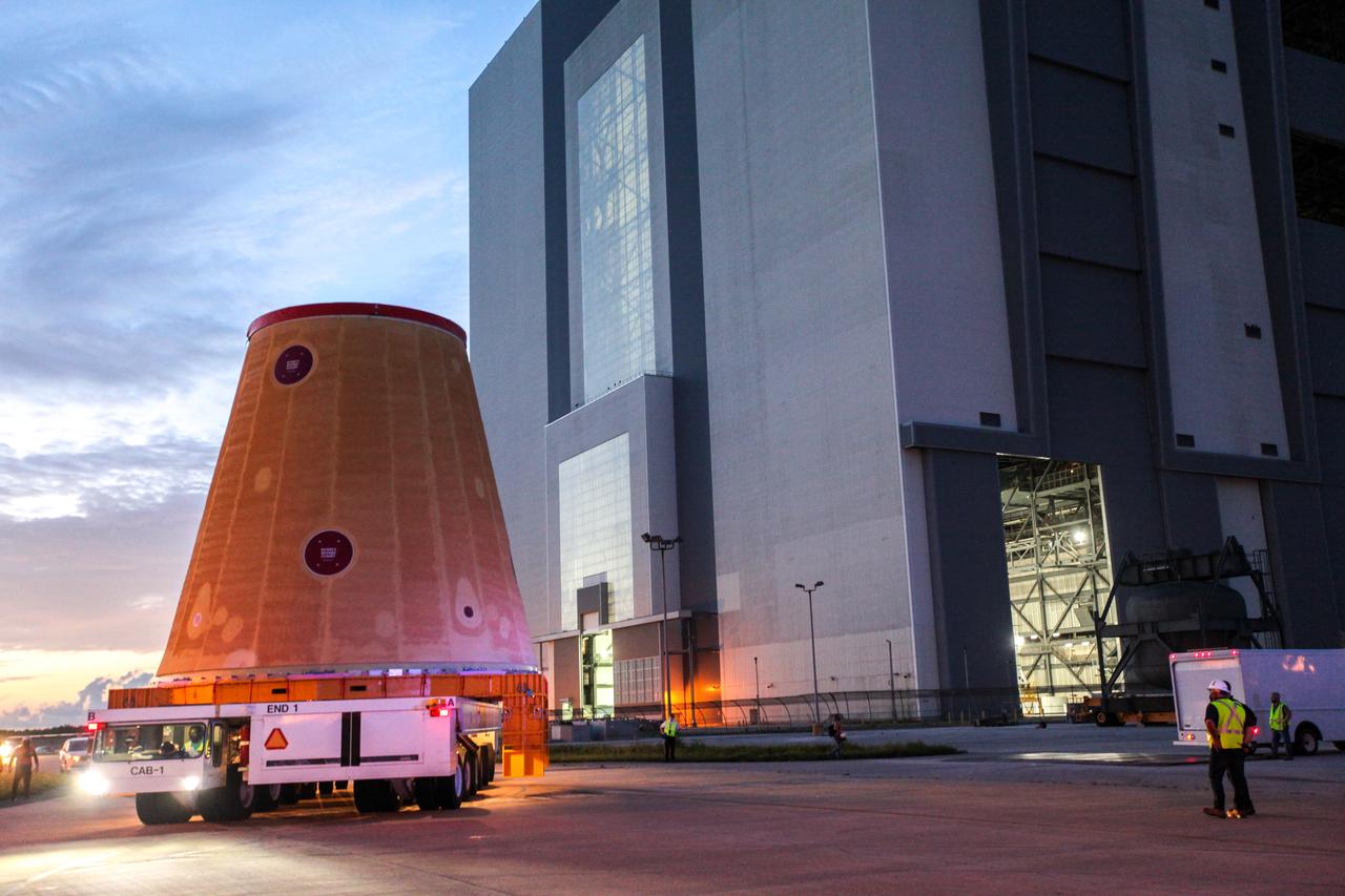 Technicians with NASA’s Exploration Ground Systems move the launch vehicle stage adapter (LVSA) for the agency’s Space Launch System (SLS) rocket to the Vehicle Assembly Building (VAB) at NASA’s Kennedy Space Center in Florida on July 30, 2020, for processing. Carried by NASA’s Pegasus barge, the LVSA arrived at Kennedy’s Launch Complex 39 turn basin wharf after departing from the agency’s Marshall Space Flight Center in Huntsville, Alabama. The LVSA will connect the SLS core stage to the rocket’s upper stage and will remain in the VAB until it’s time for stacking on the mobile launcher ahead of the Artemis I launch. The first in a series of increasingly complex missions, Artemis I will test SLS and the Orion spacecraft as an integrated system prior to crewed flights to the Moon.