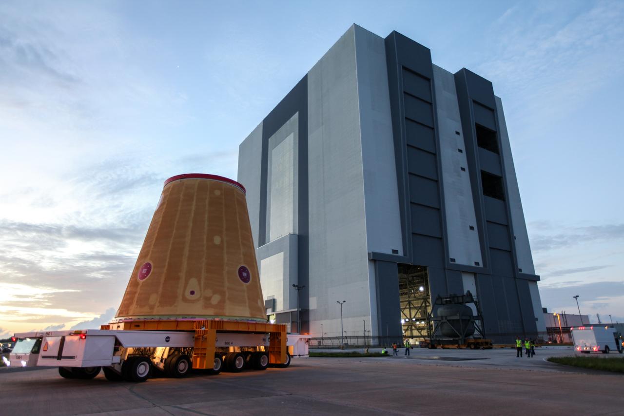 Technicians with NASA’s Exploration Ground Systems move the launch vehicle stage adapter (LVSA) for the agency’s Space Launch System (SLS) rocket to the Vehicle Assembly Building (VAB) at NASA’s Kennedy Space Center in Florida on July 30, 2020, for processing. Carried by NASA’s Pegasus barge, the LVSA arrived at Kennedy’s Launch Complex 39 turn basin wharf after departing from the agency’s Marshall Space Flight Center in Huntsville, Alabama. The LVSA will connect the SLS core stage to the rocket’s upper stage and will remain in the VAB until it’s time for stacking on the mobile launcher ahead of the Artemis I launch. The first in a series of increasingly complex missions, Artemis I will test SLS and the Orion spacecraft as an integrated system prior to crewed flights to the Moon.