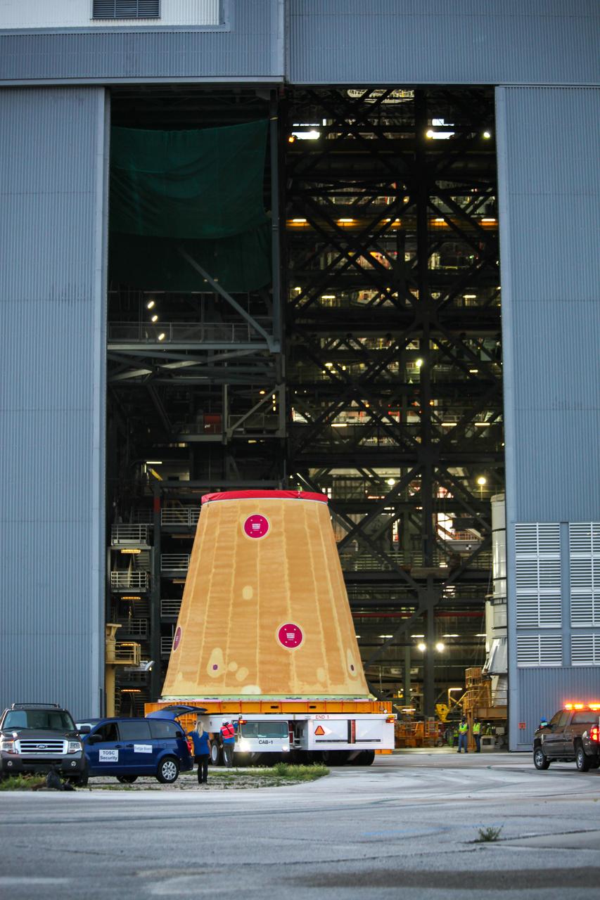 Technicians with NASA’s Exploration Ground Systems move the launch vehicle stage adapter (LVSA) for the agency’s Space Launch System (SLS) rocket into the Vehicle Assembly Building (VAB) at NASA’s Kennedy Space Center in Florida on July 30, 2020, for processing. Carried by NASA’s Pegasus barge, the LVSA arrived at Kennedy’s Launch Complex 39 turn basin wharf after departing from the agency’s Marshall Space Flight Center in Huntsville, Alabama. The LVSA will connect the SLS core stage to the rocket’s upper stage and will remain in the VAB until it’s time for stacking on the mobile launcher ahead of the Artemis I launch. The first in a series of increasingly complex missions, Artemis I will test SLS and the Orion spacecraft as an integrated system prior to crewed flights to the Moon.