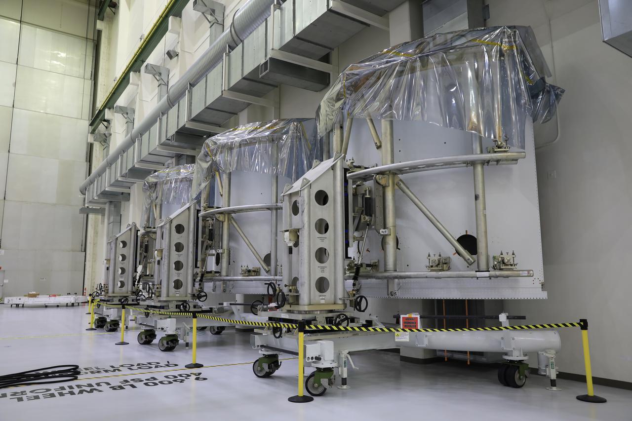 Pictured inside the Neil Armstrong Operations and Checkout Building high bay at NASA’s Kennedy Space Center in Florida on Aug. 6, 2020, are the three Spacecraft Adapter Jettison fairing panels that will protect Orion's service module from the environment around it, whether it's heat, wind or acoustics during the ascent. Unlike conventional rocket fairings, Orion's are designed to support half of the weight of the crew module and launch abort system during launch and ascent, which will maximize the size and capability of the spacecraft that can be delivered to orbit. Orion will fly on the agency’s Artemis I mission – the first in a series of increasingly complex missions to the Moon that will ultimately lead to the exploration of Mars.