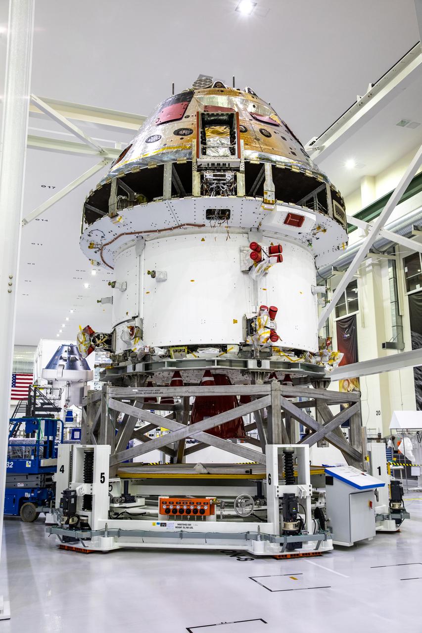 Installation of the spacecraft adapter (SA) cone to the Artemis I Orion spacecraft is in progress inside the Neil Armstrong Operations and Checkout Building at NASA’s Kennedy Space Center in Florida on Aug. 6, 2020. This is one of the final major hardware operations the spacecraft will undergo during closeout processing prior to being integrated with the Space Launch System (SLS) rocket in preparation for the first Artemis mission. The spacecraft adapter cone connects the bottom portion of Orion’s service module to the top part of the rocket known as the interim cryogenic propulsion stage (ICPS). Orion will fly on the agency’s Artemis I mission – the first in a series of increasingly complex missions to the Moon that will ultimately lead to the exploration of Mars.