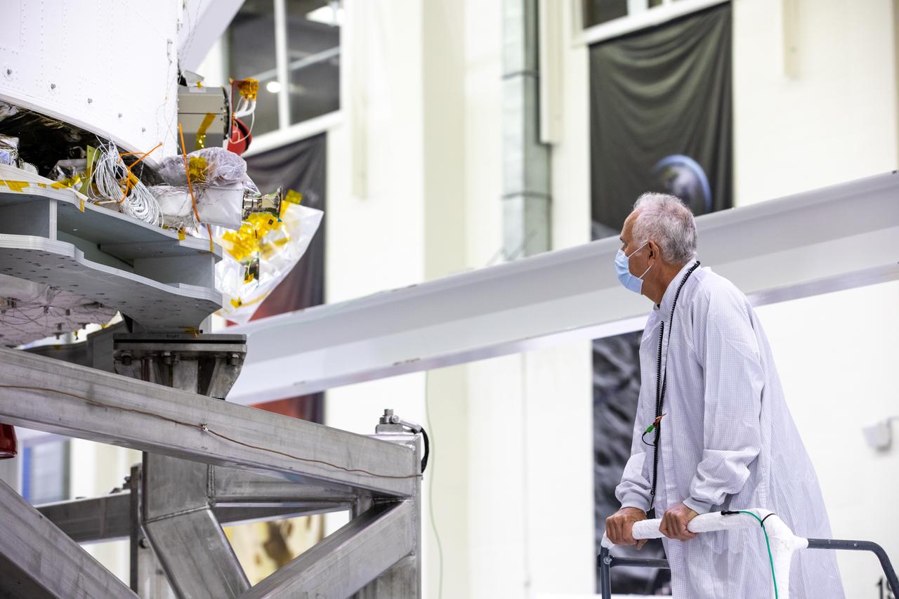 Vince Nichols, Lockheed Martin Floor Operations, inspects the Artemis I Orion spacecraft in preparation for installation of the spacecraft adapter (SA) cone inside the Neil Armstrong Operations and Checkout Building at NASA’s Kennedy Space Center in Florida on Aug. 6, 2020. This is one of the final major hardware operations the spacecraft will undergo during closeout processing prior to being integrated with the Space Launch System (SLS) rocket in preparation for the first Artemis mission. The spacecraft adapter cone connects the bottom portion of Orion’s service module to the top part of the rocket known as the interim cryogenic propulsion stage (ICPS). Orion will fly on the agency’s Artemis I mission – the first in a series of increasingly complex missions to the Moon that will ultimately lead to the exploration of Mars.