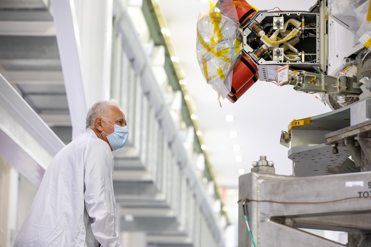Vince Nichols, Lockheed Martin Floor Operations, inspects the Artemis I Orion spacecraft in preparation for installation of the spacecraft adapter (SA) cone inside the Neil Armstrong Operations and Checkout Building at NASA’s Kennedy Space Center in Florida on Aug. 6, 2020. This is one of the final major hardware operations the spacecraft will undergo during closeout processing prior to being integrated with the Space Launch System (SLS) rocket in preparation for the first Artemis mission. The spacecraft adapter cone connects the bottom portion of Orion’s service module to the top part of the rocket known as the interim cryogenic propulsion stage (ICPS). Orion will fly on the agency’s Artemis I mission – the first in a series of increasingly complex missions to the Moon that will ultimately lead to the exploration of Mars.