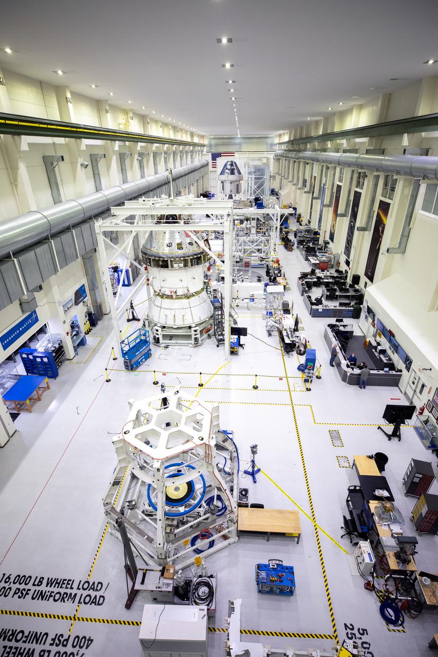 Installation of the spacecraft adapter (SA) cone to the Artemis I Orion spacecraft shown in progress inside the Neil Armstrong Operations and Checkout Building on Aug. 10, 2020. This is one of the final major hardware operations the spacecraft will undergo during closeout processing prior to being integrated with the Space Launch System (SLS) rocket in preparation for the first Artemis mission. The spacecraft adapter cone connects the bottom portion of Orion’s service module to the top part of the rocket known as the interim cryogenic propulsion stage (ICPS). Orion will fly on the agency’s Artemis I mission – the first in a series of increasingly complex missions to the Moon that will ultimately lead to the exploration of Mars.