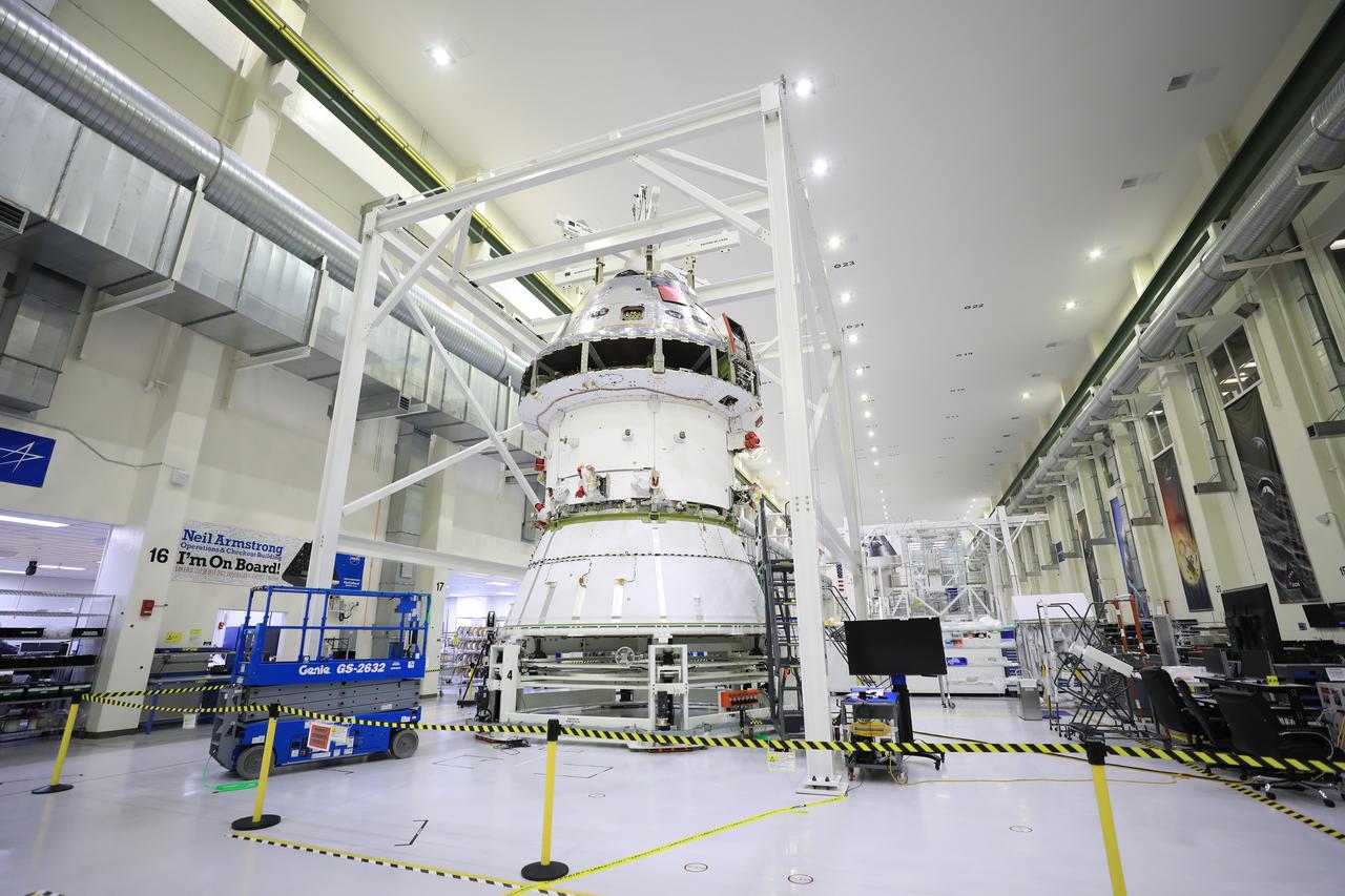 Technicians at NASA’s Kennedy Space Center in Florida work to install the spacecraft adapter (SA) cone to the Artemis I Orion spacecraft inside the Neil Armstrong Operations and Checkout Building on Aug. 10, 2020. This is one of the final major hardware operations the spacecraft will undergo during closeout processing prior to being integrated with the Space Launch System (SLS) rocket in preparation for the first Artemis mission. The spacecraft adapter cone connects the bottom portion of Orion’s service module to the top part of the rocket known as the interim cryogenic propulsion stage (ICPS). Orion will fly on the agency’s Artemis I mission – the first in a series of increasingly complex missions to the Moon that will ultimately lead to the exploration of Mars.
