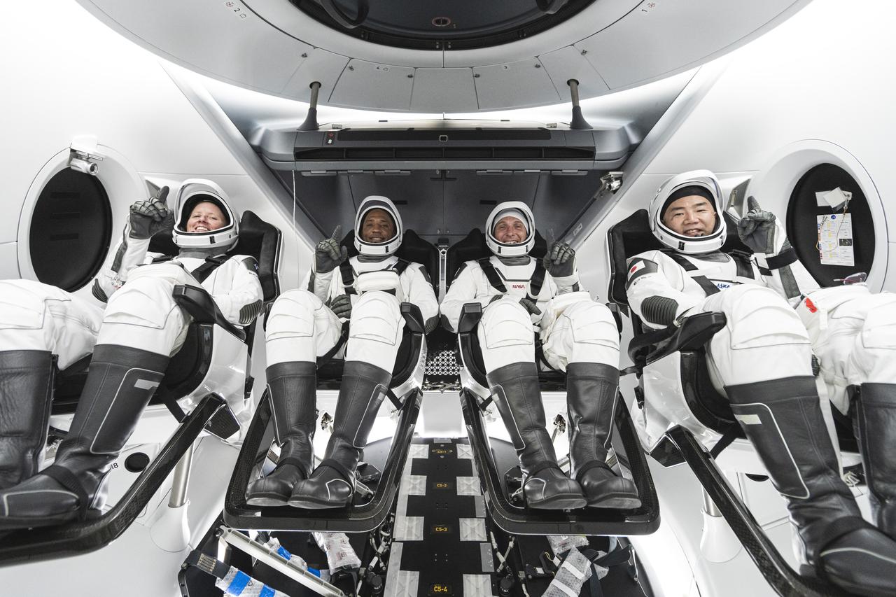 From left, Mission Specialist Shannon Walker, Pilot Victor Glover, Crew Dragon Commander Michael Hopkins – all NASA astronauts – and Japan Aerospace Exploration Agency (JAXA) astronaut and Mission Specialist Soichi Noguchi are seated in SpaceX’s Crew Dragon spacecraft during crew equipment interface training. Walker, Glover, Hopkins, and Noguchi will launch to the International Space Station on the agency’s SpaceX Crew-1 mission. This will be the first operational mission to the orbiting laboratory under NASA’s Commercial Crew Program following the agency’s certification of SpaceX’s crew transportation system. The crew will launch from Kennedy Space Center’s Launch Complex 39A in Florida.