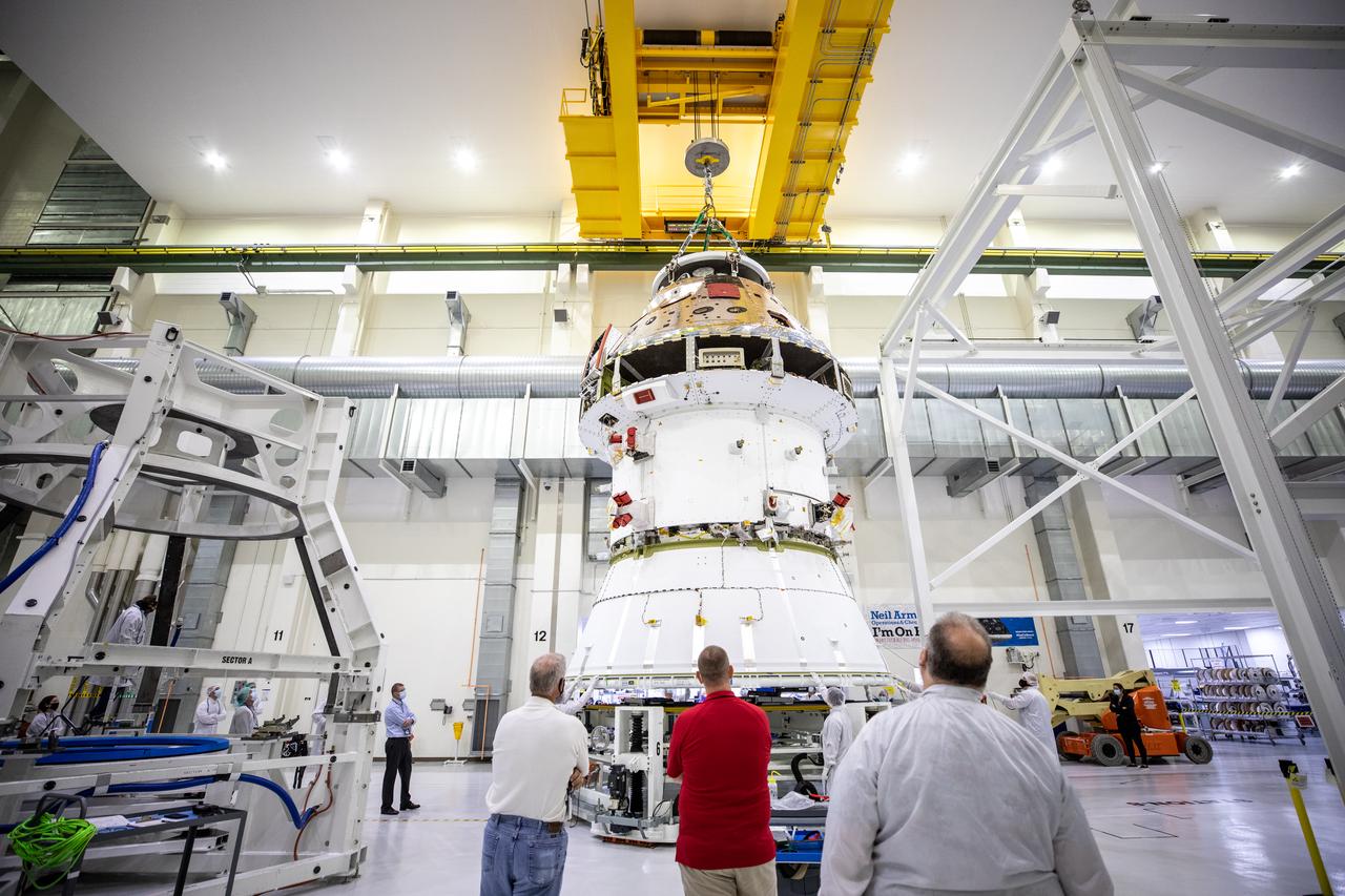 Technicians at NASA’s Kennedy Space Center in Florida work to safely return the Artemis I Orion spacecraft to the FAST cell after completing the installation of the spacecraft adapter (SA) cone inside the Neil Armstrong Operations and Checkout Building on Aug. 20, 2020. This is one of the final major hardware operations the spacecraft will undergo during closeout processing prior to being integrated with the Space Launch System (SLS) rocket in preparation for the first Artemis mission. The spacecraft adapter cone connects the bottom portion of Orion’s service module to the top part of the rocket known as the interim cryogenic propulsion stage (ICPS). Orion will fly on the agency’s Artemis I mission – the first in a series of increasingly complex missions to the Moon that will ultimately lead to the exploration of Mars.