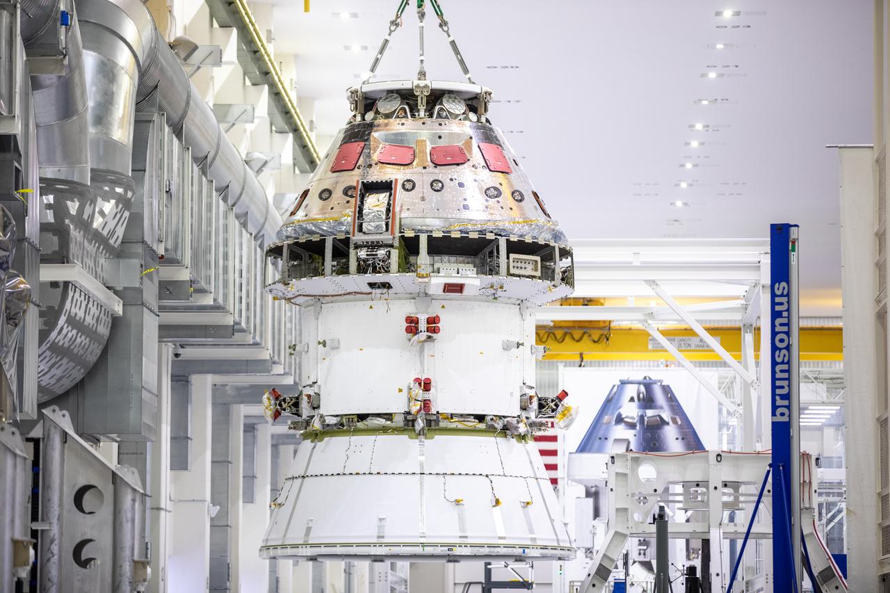 Technicians at NASA’s Kennedy Space Center in Florida work to safely return the Artemis I Orion spacecraft to the FAST cell after completing the installation of the spacecraft adapter (SA) cone inside the Neil Armstrong Operations and Checkout Building on Aug. 20, 2020. This is one of the final major hardware operations the spacecraft will undergo during closeout processing prior to being integrated with the Space Launch System (SLS) rocket in preparation for the first Artemis mission. The spacecraft adapter cone connects the bottom portion of Orion’s service module to the top part of the rocket known as the interim cryogenic propulsion stage (ICPS). Orion will fly on the agency’s Artemis I mission – the first in a series of increasingly complex missions to the Moon that will ultimately lead to the exploration of Mars.