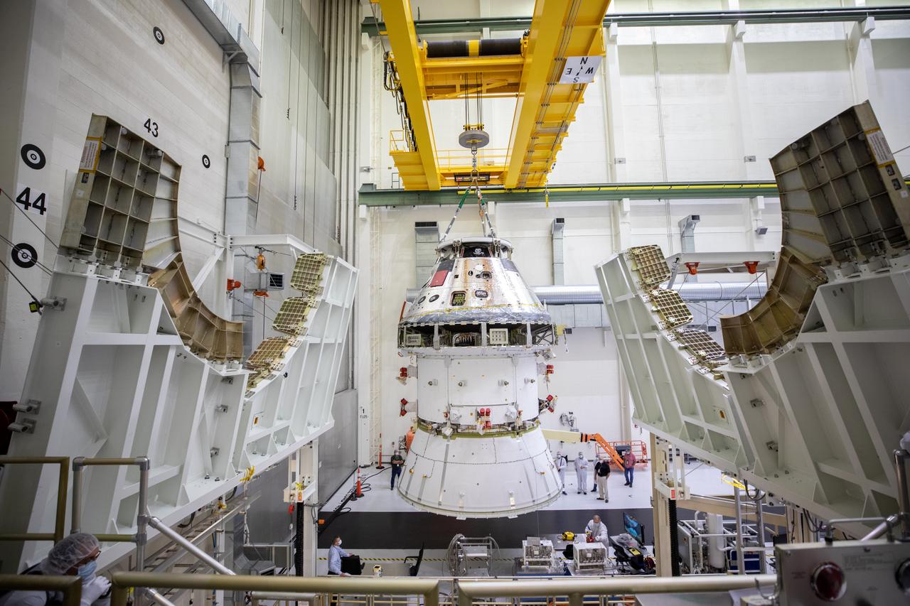 The Artemis I Orion spacecraft with its spacecraft adapter cone attached, is moved by crane into the FAST cell inside the Neil Armstrong Operations and Checkout Building at NASA’s Kennedy Space Center in Florida on Aug. 20, 2020. This is one of the final major hardware operations the spacecraft will undergo during closeout processing prior to being integrated with the Space Launch System (SLS) rocket in preparation for the first Artemis mission. The spacecraft adapter cone connects the bottom portion of Orion’s service module to the top part of the rocket known as the interim cryogenic propulsion stage (ICPS). Orion will fly on the agency’s Artemis I mission – the first in a series of increasingly complex missions to the Moon that will ultimately lead to the exploration of Mars.