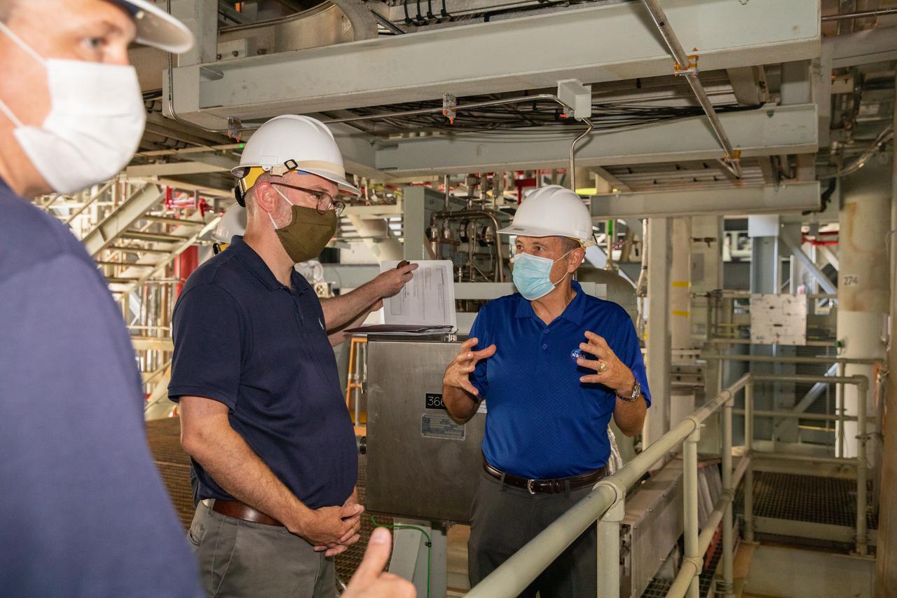 Kennedy Space Center Director Bob Cabana, far right, accompanies Russell Vought, second from right, director of the White House Office of Management and Budget, and NASA Administrator Jim Bridenstine, far left, on a tour of the Vehicle Assembly Building (VAB) on Aug. 28, 2020. The VAB is critical to the assembly of the Space Launch System rocket for NASA’s Artemis program. The Office of Management and Budget is working with the U.S. Congress to line up the necessary resources to land the first woman and the next man on the Moon in 2024.