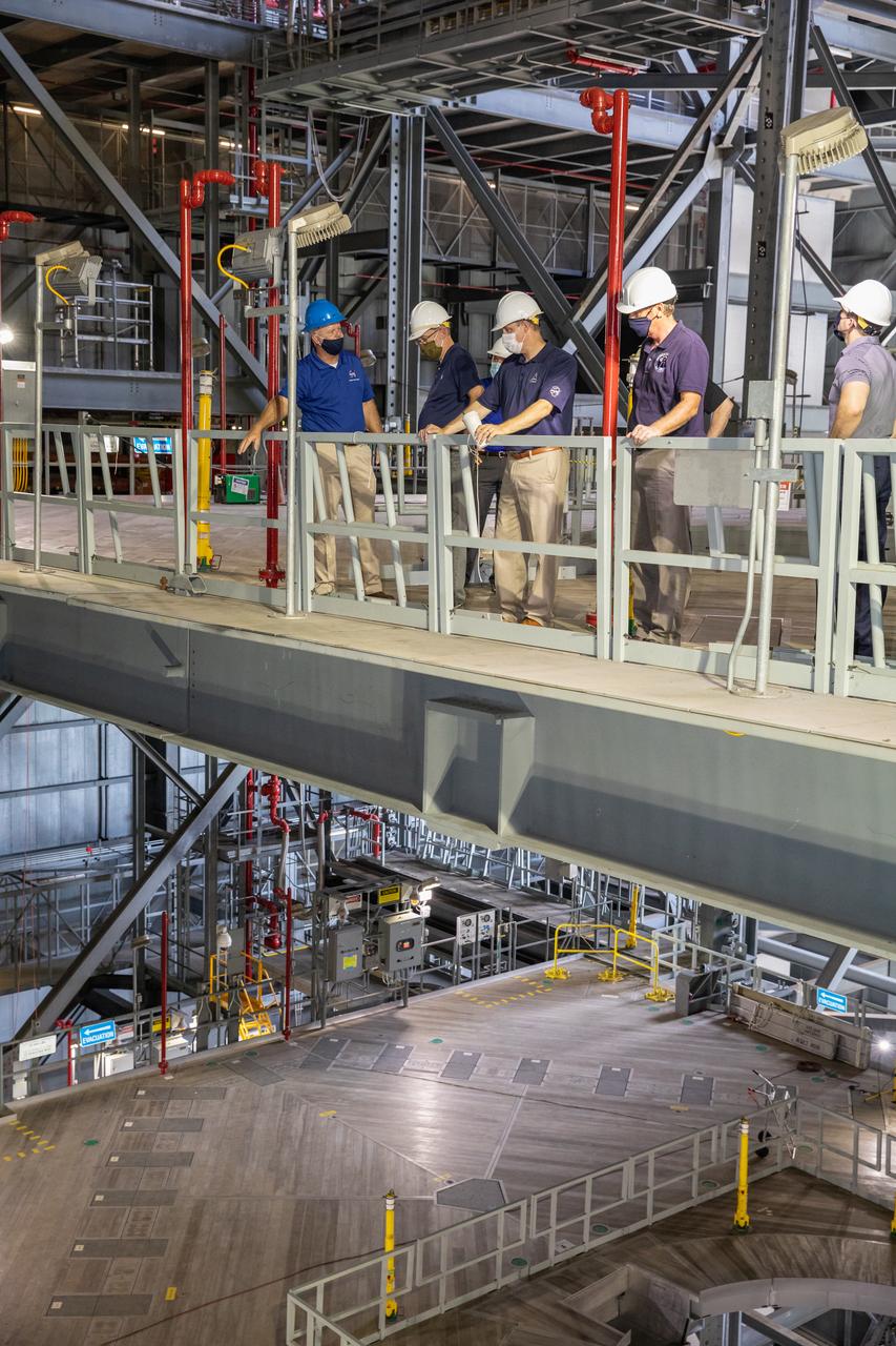Russell Vought, director of the White House Office of Management and Budget, second from left, and NASA Administrator Jim Bridenstine, are on a tour of the Vehicle Assembly Building on Aug. 28, 2020.  In this photo, they are viewing one of the levels of new service platforms in High Bay 3. The VAB is critical to the assembly of the Space Launch System rocket for NASA’s Artemis program. The Office of Management and Budget is working with the U.S. Congress to line up the necessary resources to land the first woman and the next man on the Moon in 2024.