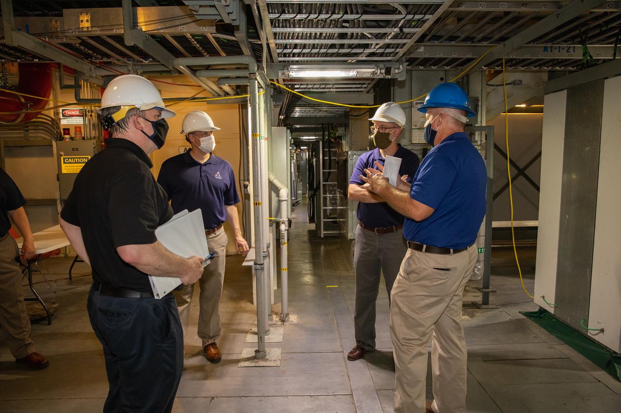 Darrell Foster, far right, chief of the Project Management Division in Exploration Ground Systems, briefs from left, Brian McCormack, associate director of the White House Office of Management and Budget, NASA Administrator Jim Bridenstine, and Russell Vought, director of the White House Office of Management and Budget, while on a tour of the Vehicle Assembly Building on Aug. 28, 2020. The VAB is critical to the assembly of the Space Launch System rocket for NASA’s Artemis program. The Office of Management and Budget is working with the U.S. Congress to line up the necessary resources to land the first woman and the next man on the Moon in 2024.