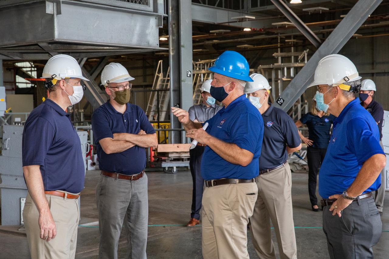 NASA Administrator Jim Bridenstine, far left, Russell Vought, director of the White House Office of Management and Budget, second from left, and Kennedy Space Center Director Bob Cabana, far right, are on a tour of the Vehicle Assembly Building on Aug. 28, 2020. The VAB is critical to the assembly of the Space Launch System rocket for NASA’s Artemis program. The Office of Management and Budget is working with the U.S. Congress to line up the necessary resources to land the first woman and the next man on the Moon in 2024.