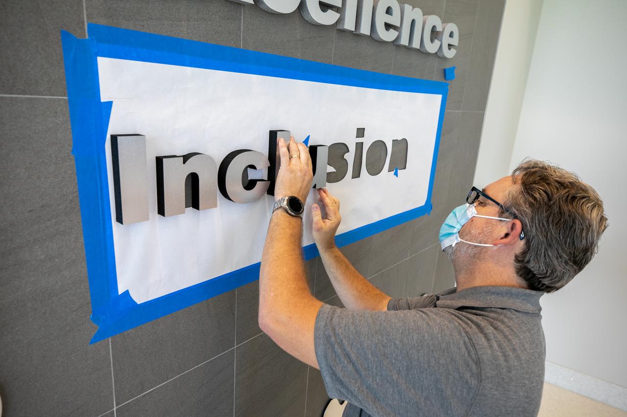 NASA’s fifth core value – inclusion – is installed in the Central Campus lobby at the agency’s Kennedy Space Center in Florida on Sept. 1, 2020. On July 23, NASA Administrator Jim Bridenstine announced the addition of this fifth core value to the existing values embraced by NASA: safety, integrity, teamwork, and excellence. In his announcement, Bridenstine stated “Incorporating inclusion as a NASA core value is an important step to ensuring this principle remains a long-term focus for our agency and becomes ingrained in the NASA family DNA.”