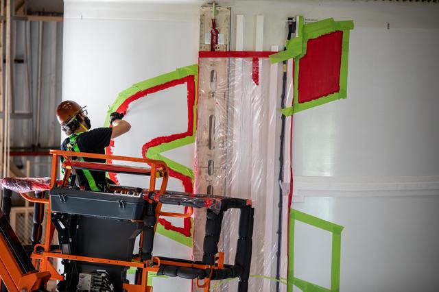 NASA image: Worm Logo Painting on SLS Booster Segments