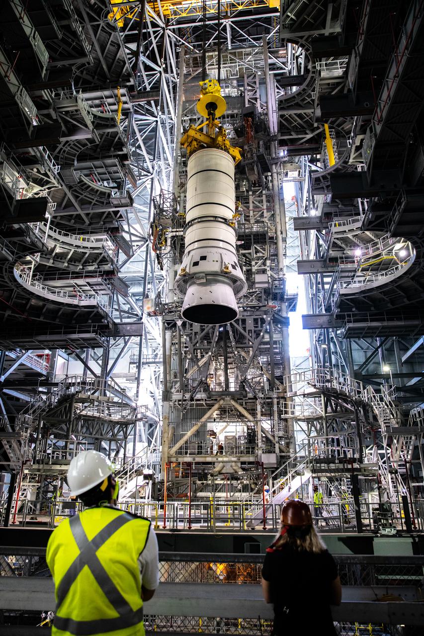During a training exercise, technicians with NASA’s Exploration Ground Systems lower a mock-up of the Space Launch System (SLS) aft booster segment, referred to as a pathfinder, onto the mobile launcher in Kennedy Space Center’s Vehicle Assembly Building (VAB) on Sept. 11, 2020. The rehearsal involved teams preparing the aft pathfinder segment in High Bay 4 of the VAB, lifting and moving it over to High Bay 3, and placing it on the mobile launcher in preparation for Artemis I. Stacking of the actual booster segments will occur later this year, before the SLS core stage arrives at the Florida spaceport. Artemis I is the first in a series of increasingly complex missions that will test SLS and the Orion spacecraft as an integrated system prior to crewed flights to the Moon.