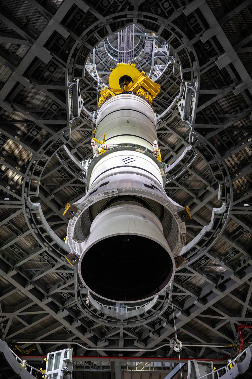 During a training exercise, technicians with NASA’s Exploration Ground Systems lower a mock-up of the Space Launch System (SLS) aft booster segment, referred to as a pathfinder, onto the mobile launcher in Kennedy Space Center’s Vehicle Assembly Building (VAB) on Sept. 11, 2020. The rehearsal involved teams preparing the aft pathfinder segment in High Bay 4 of the VAB, lifting and moving it over to High Bay 3, and placing it on the mobile launcher in preparation for Artemis I. Stacking of the actual booster segments will occur later this year, before the SLS core stage arrives at the Florida spaceport. Artemis I is the first in a series of increasingly complex missions that will test SLS and the Orion spacecraft as an integrated system prior to crewed flights to the Moon.