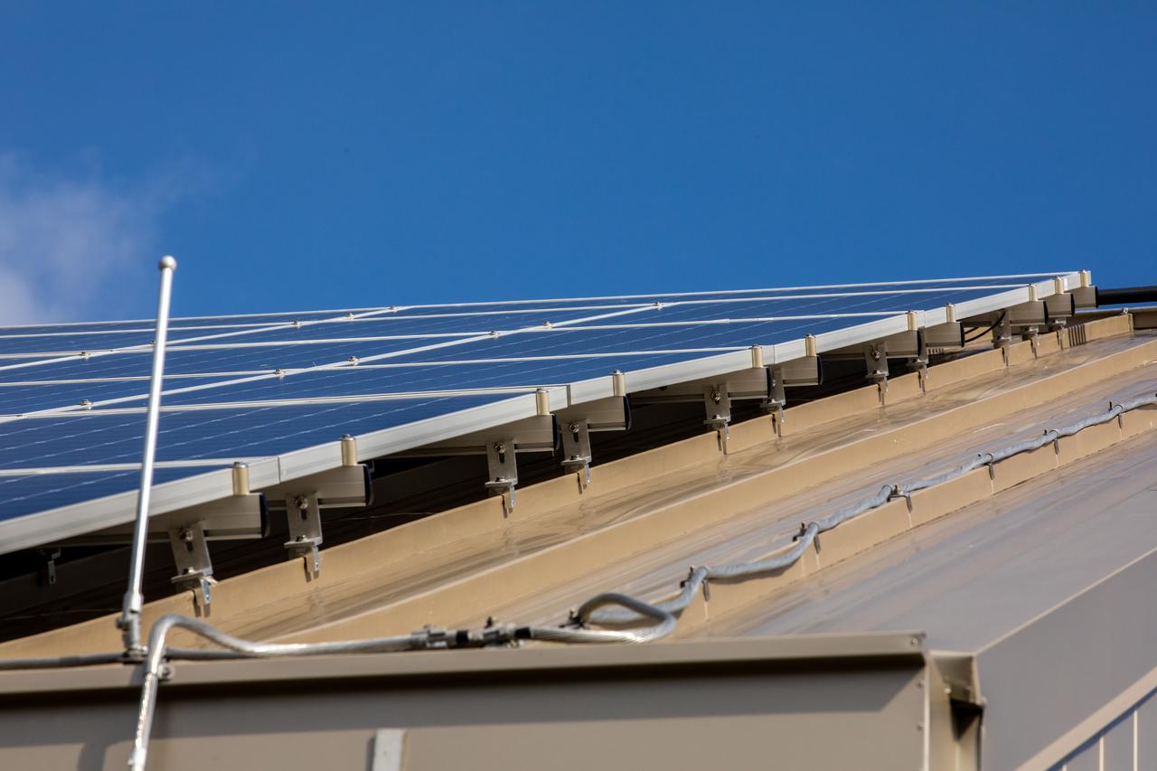The Electrical Maintenance Facility (EMF) at NASA's Kennedy Space Center in Florida has solar panels capable of producing 125 kilowatts. Installation of the panels began in August 2019 and by February 2020, the panels were up and running, generating enough power to supply the facility. The addition of the solar panels has turned the EMF into a "net positive" facility, meaning it now produces more energy than it consumes.