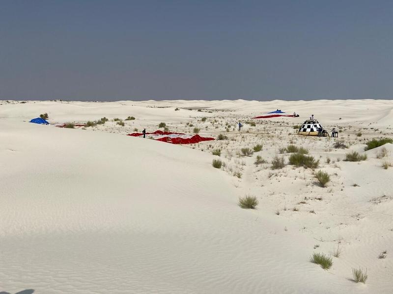 Recovery teams gather at the landing site of Boeing’s CST-100 Starliner test article used in the spacecraft's final parachute reliability test at White Sands Space Harbor, New Mexico, on Sept. 19, 2020. The test is part of a reliability campaign that will help strengthen the spacecraft’s landing system ahead of crewed flights to and from the International Space Station as part of NASA’s Commercial Crew Program.