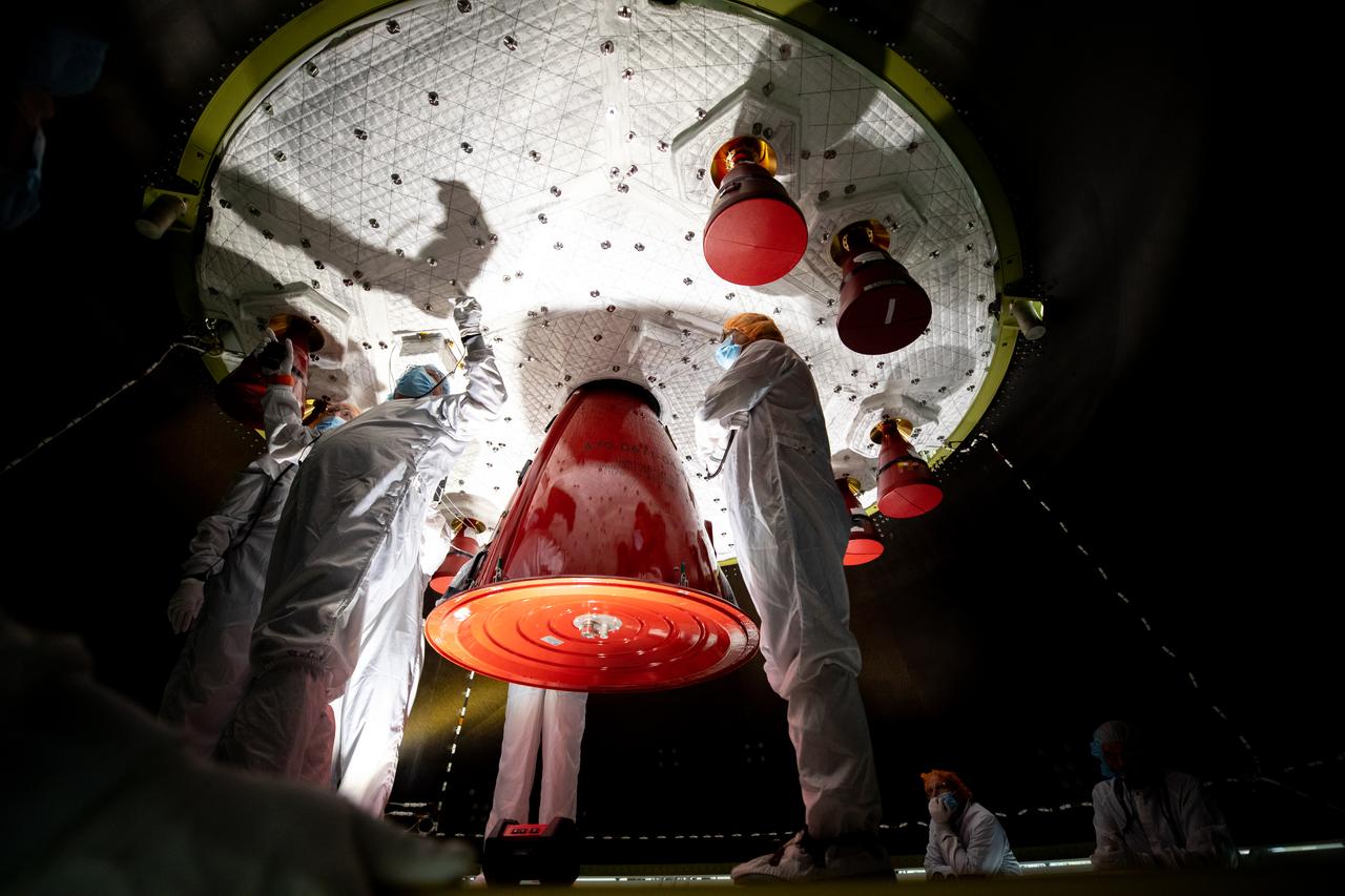Members of the European Service Module processing team from the European Space Agency and Airbus inspect the insulation on the underside of the Orion service module for Artemis I inside the Neil Armstrong Operations and Checkout Building high bay at NASA’s Kennedy Space Center in Florida on Sept. 23, 2020. Work is also underway to attach protective covers over the solar arrays wings that were installed on the service module. Each solar array panel will generate 11 kilowatts of power and span about 63 feet. The array is a component of Orion’s service module, which is provided by the European Space Agency and built by Airbus Defence and Space to supply Orion’s power, propulsion, air and water. The first in a series of increasingly complex missions, Artemis I will test the Orion spacecraft and Space Launch System as an integrated system ahead of crewed flights to the Moon. Under the Artemis program, NASA will land the first woman and the next man on the Moon in 2024.