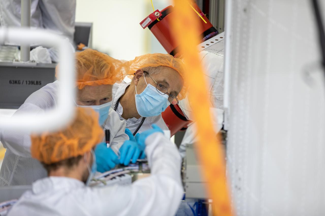 Members of the European Service Module processing team from the European Space Agency (ESA), Airbus, and Airbus Netherlands install the four solar array wings on the Orion spacecraft for Artemis I inside the Neil Armstrong Operations and Checkout Building high bay at NASA’s Kennedy Space Center in Florida on Sept. 25, 2020. The solar arrays were extended, inspected, and then retracted before installation on the spacecraft. Each solar array panel will generate 11 kilowatts of power and span about 63 feet. The array is a component of Orion’s service module, which is provided by ESA and built by Airbus Defence and Space to supply Orion’s power, propulsion, air, and water. The first in a series of increasingly complex missions, Artemis I will test the Orion spacecraft and Space Launch System as an integrated system ahead of crewed flights to the Moon. Under the Artemis program, NASA will land the first woman and the next man on the Moon in 2024.