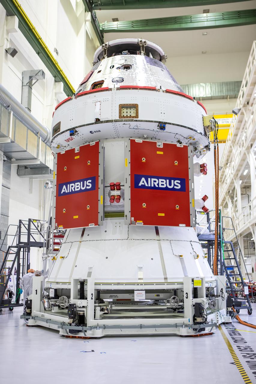 In view, protective covers have been placed over two solar array wings after installation was completed on the Orion spacecraft for Artemis I inside the Neil Armstrong Operations and Checkout Building high bay at NASA’s Kennedy Space Center in Florida on Sept. 25, 2020. The solar arrays were extended, inspected, and then retracted before installation on the spacecraft. Each of the four solar array panels will generate 11 kilowatts of power and span about 63 feet. The array is a component of Orion’s service module, which is provided by the European Space Agency and built by Airbus Defence and Space to supply Orion’s power, propulsion, air, and water. The first in a series of increasingly complex missions, Artemis I will test the Orion spacecraft and Space Launch System as an integrated system ahead of crewed flights to the Moon. Under the Artemis program, NASA will land the first woman and the next man on the Moon in 2024.