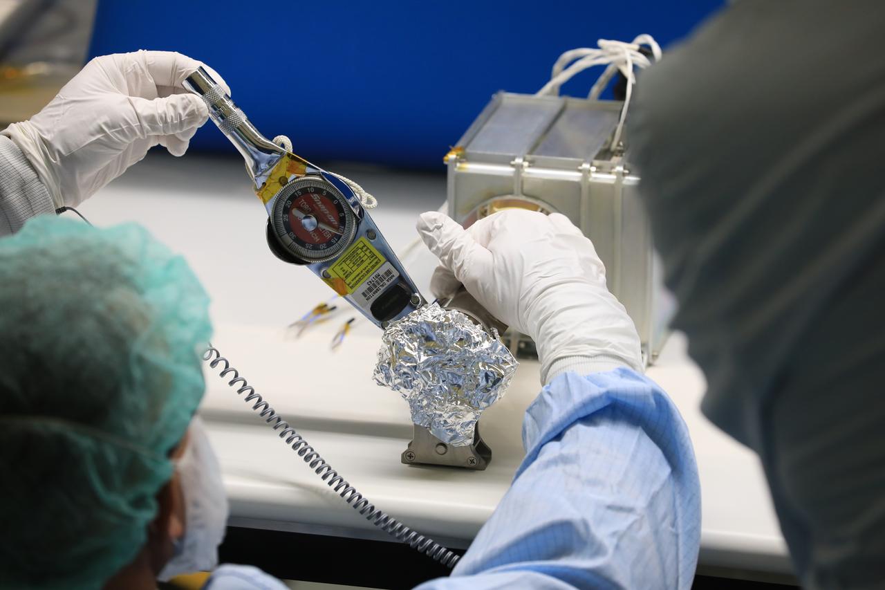 Engineers and technicians at NASA’s Kennedy Space Center in Florida work with instruments for Mass Spectrometer observing lunar operations (MSolo) inside the Space Station Processing on Sept. 25, 2020. MSolo is a commercial off-the-shelf mass spectrometer modified to work in space and it will help analyze the chemical makeup of landing sites on the Moon, as well as study water on the lunar surface. This work is preparing MSolo hardware for a robotic mission as part of the Commercial Lunar Payload Services (CLPS) launching to exploring Lacus Mortis, a large crater on the near side of the Moon in 2021. A future mission will send a mobile robot named the Volatiles Investigating Polar Exploration Rover (VIPER) to the Moon to prospect for water. VIPER will have several instruments that will allow it to detect and sample water including MSolo, the Neutron Spectrometer System, the Near Infrared Volatiles Spectrometer System and The Regolith and Ice Drill for Exploring New Terrain (TRIDENT).