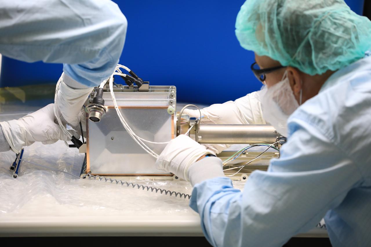 Engineers and technicians at NASA’s Kennedy Space Center in Florida install the radiator for the Mass Spectrometer Observing Lunar Operations (MSolo) instrument inside the Space Station Processing Facility on Sept. 25, 2020. MSolo will help analyze the chemical makeup of landing sites on the Moon, as well as study water on the lunar surface. The radiator will help keep the instrument’s temperature stable in the extreme heat and cold it will encounter. MSolo instruments are scheduled to launch on multiple robotic missions as part of NASA’s Commercial Lunar Payload Services (CLPS), with the first of these missions exploring Lacus Mortis, a large crater on the near side of the Moon, beginning in 2021. MSolo also will be one of three instruments on the agency’s water-hunting Volatiles Investigating Polar Exploration Rover, VIPER, scheduled to launch to the Moon’s South Pole in late 2023.