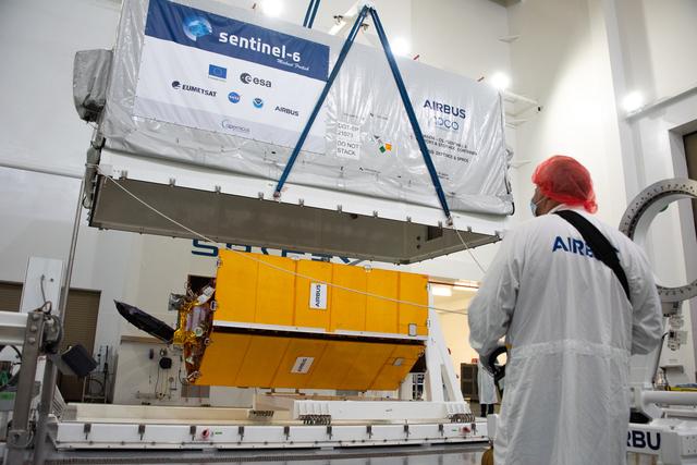NASA image: Sentinel-6 Spacecraft Removal from Container, Lift to MPT